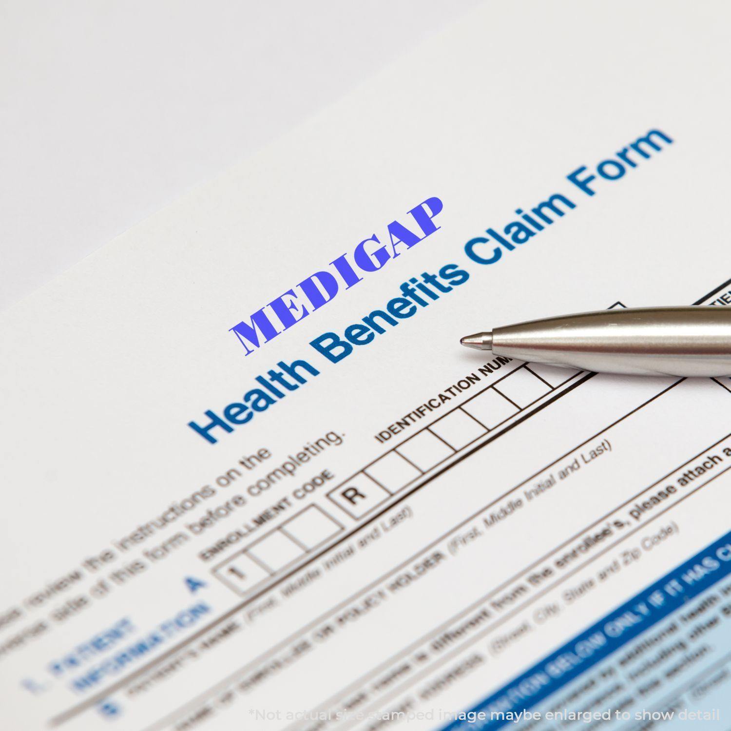 A Large Medigap Rubber Stamp marks a health benefits claim form, with a pen pointing at the identification number section.