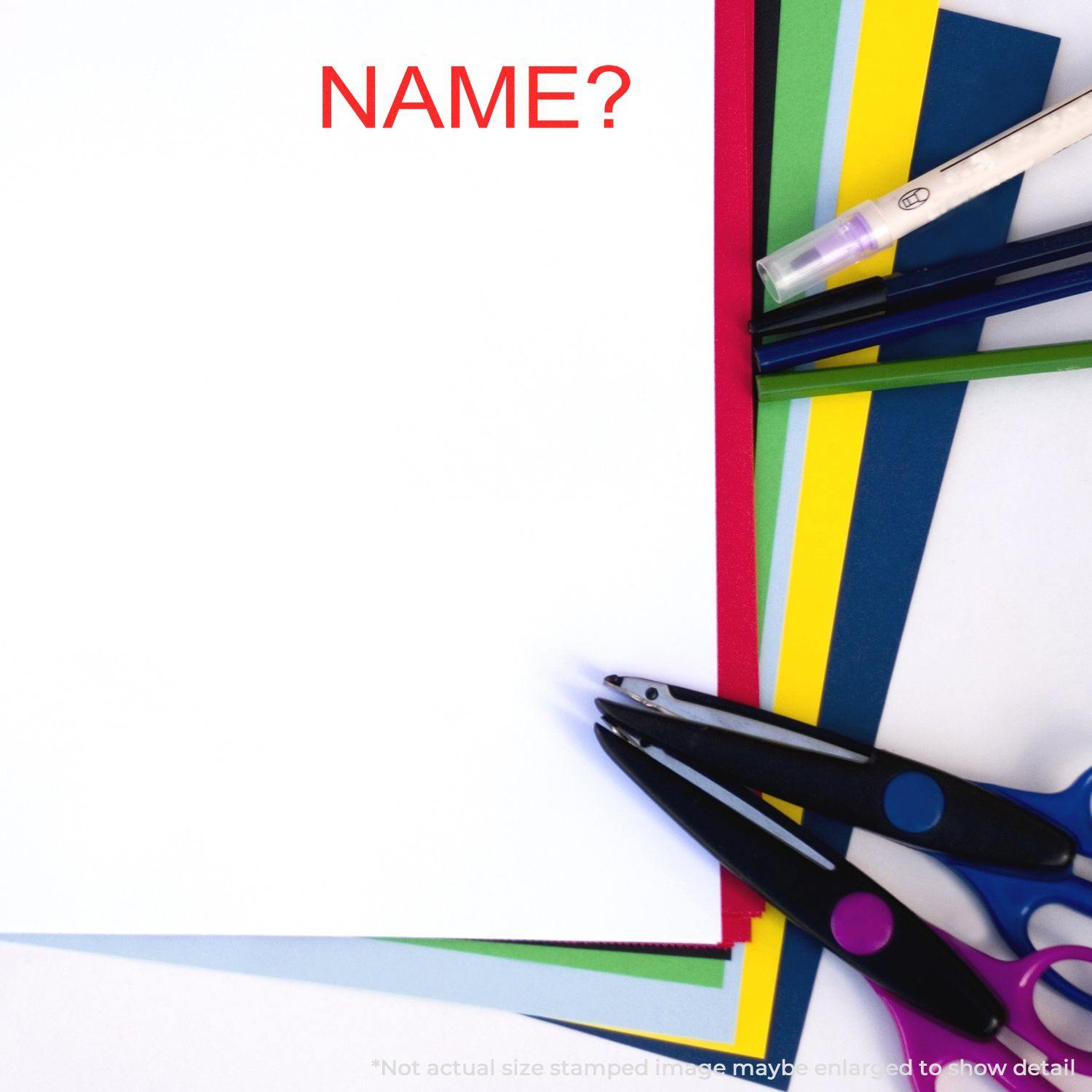 Large Name Rubber Stamp in use on white paper with colorful sheets, scissors, and pens around.