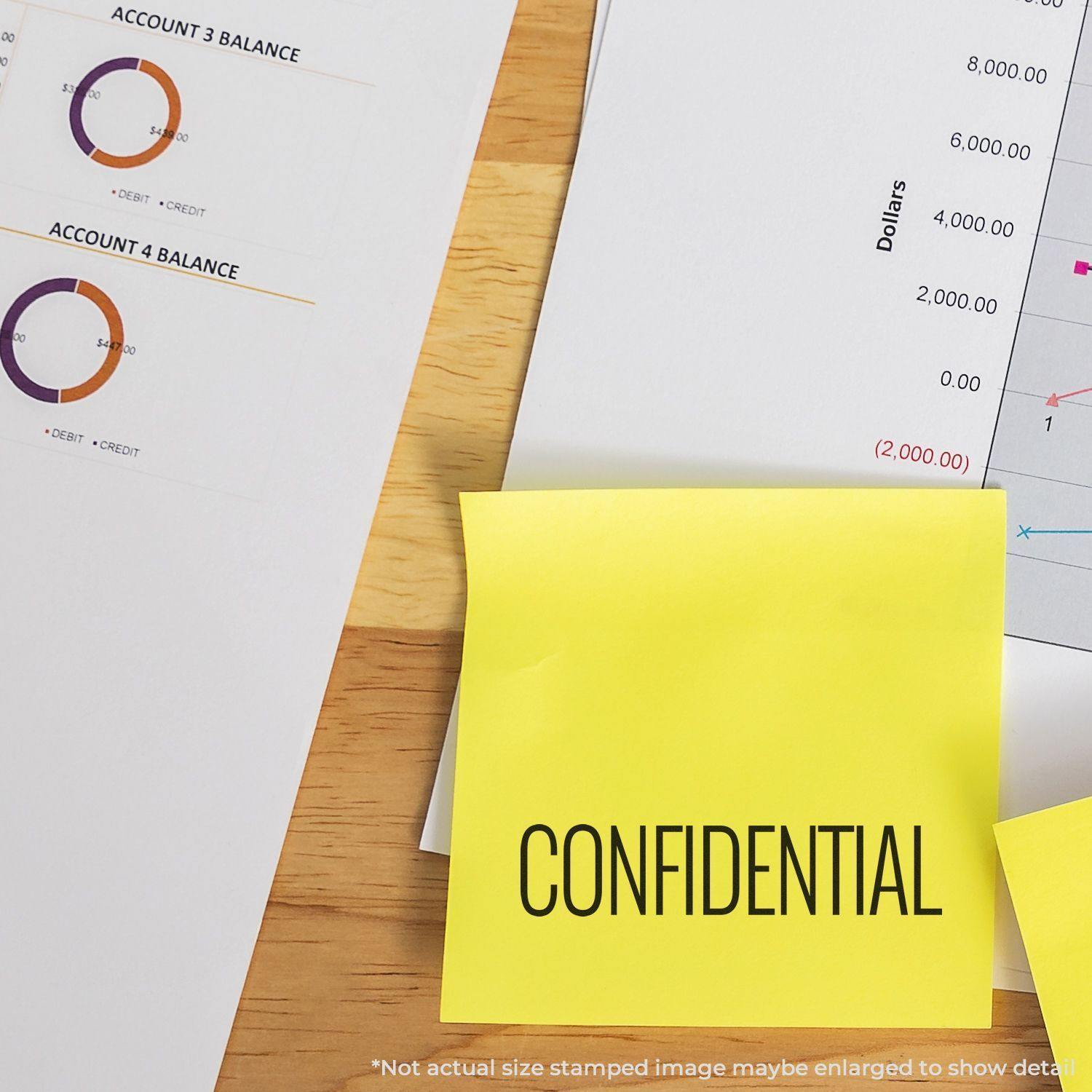 A yellow sticky note stamped with CONFIDENTIAL using the Large Pre-Inked Narrow Font Confidential Stamp, placed on financial documents.