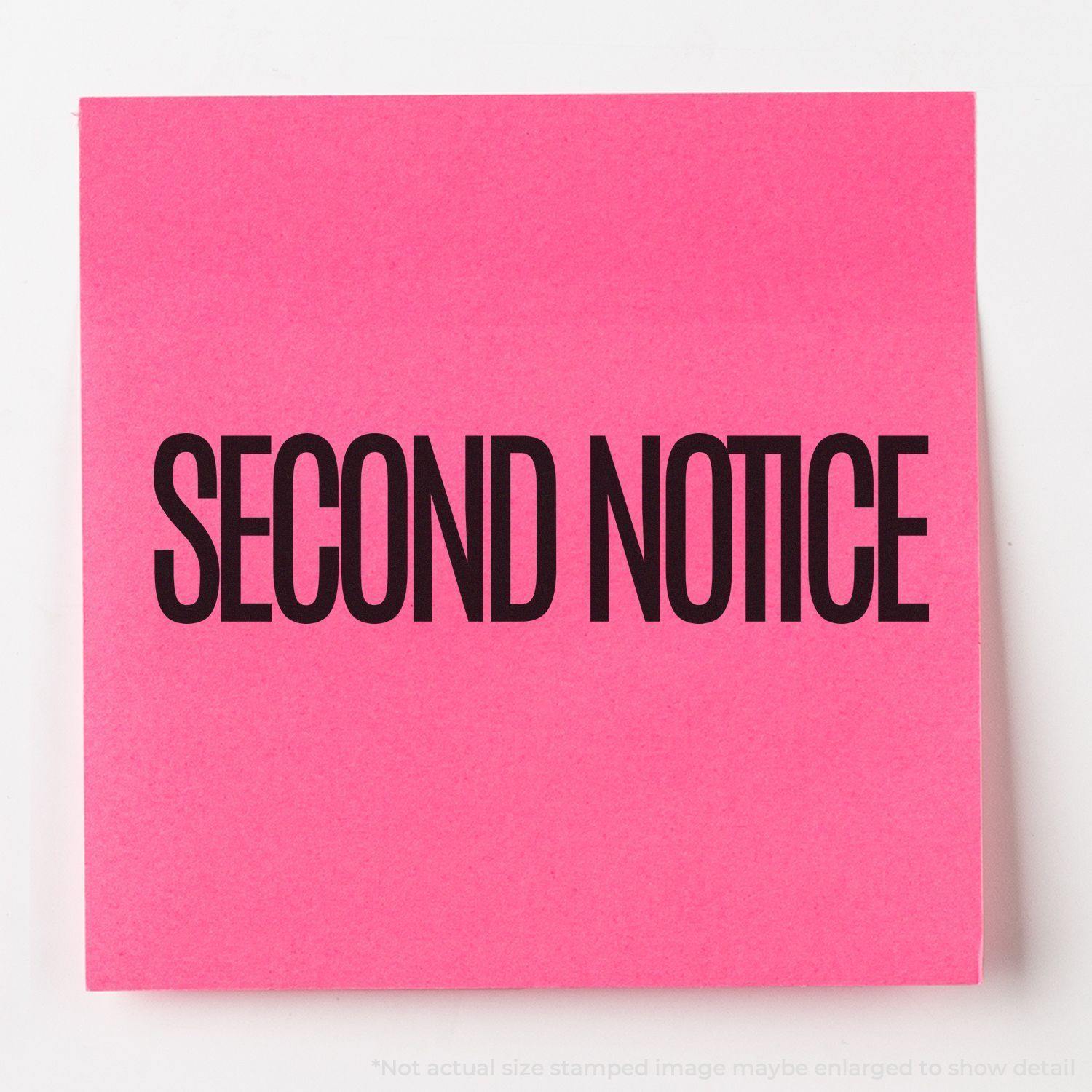 Slim Pre-Inked Narrow Font Second Notice Stamp on a bright pink sticky note with bold black text reading SECOND NOTICE.