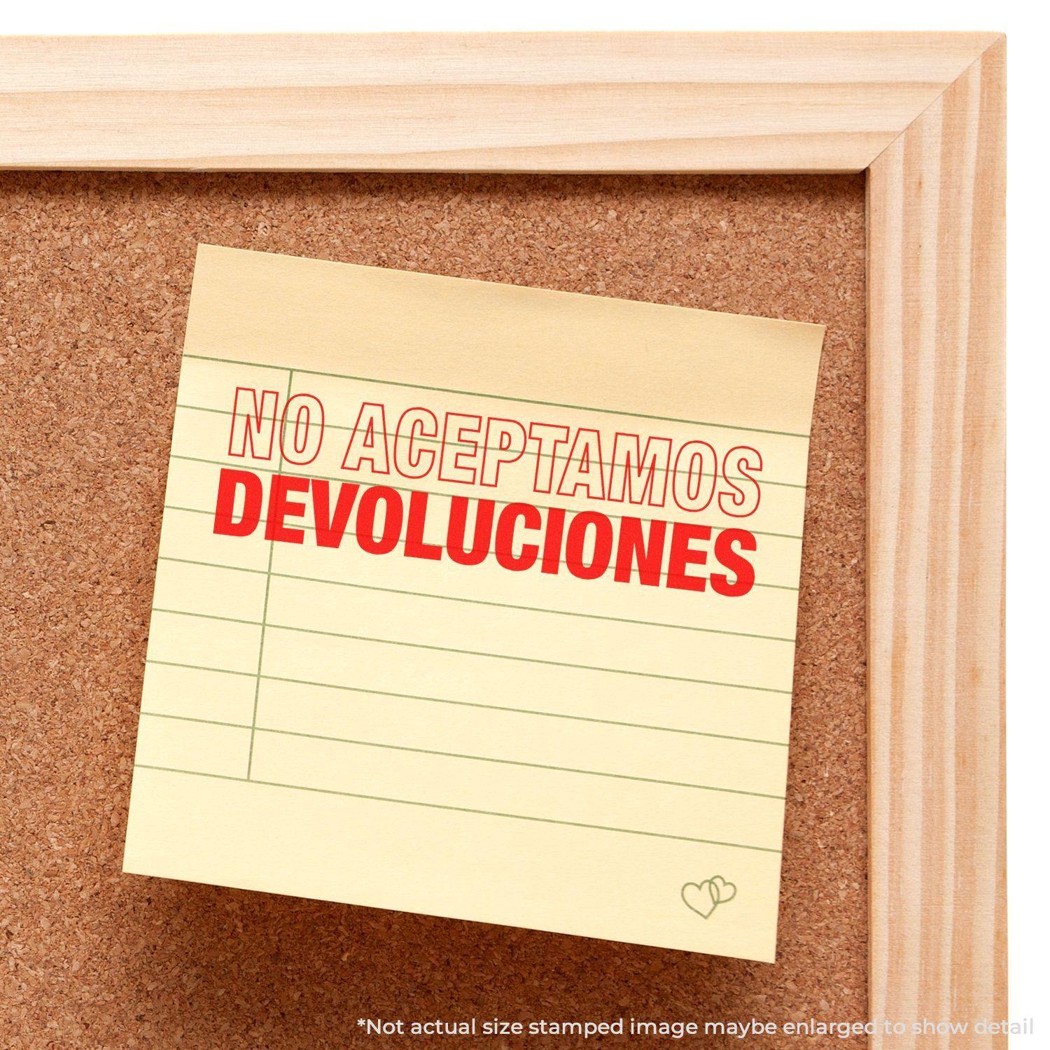 A corkboard with a sticky note stamped NO ACEPTAMOS DEVOLUCIONES using the Large Self Inking No Aceptamos Devolucions Stamp.