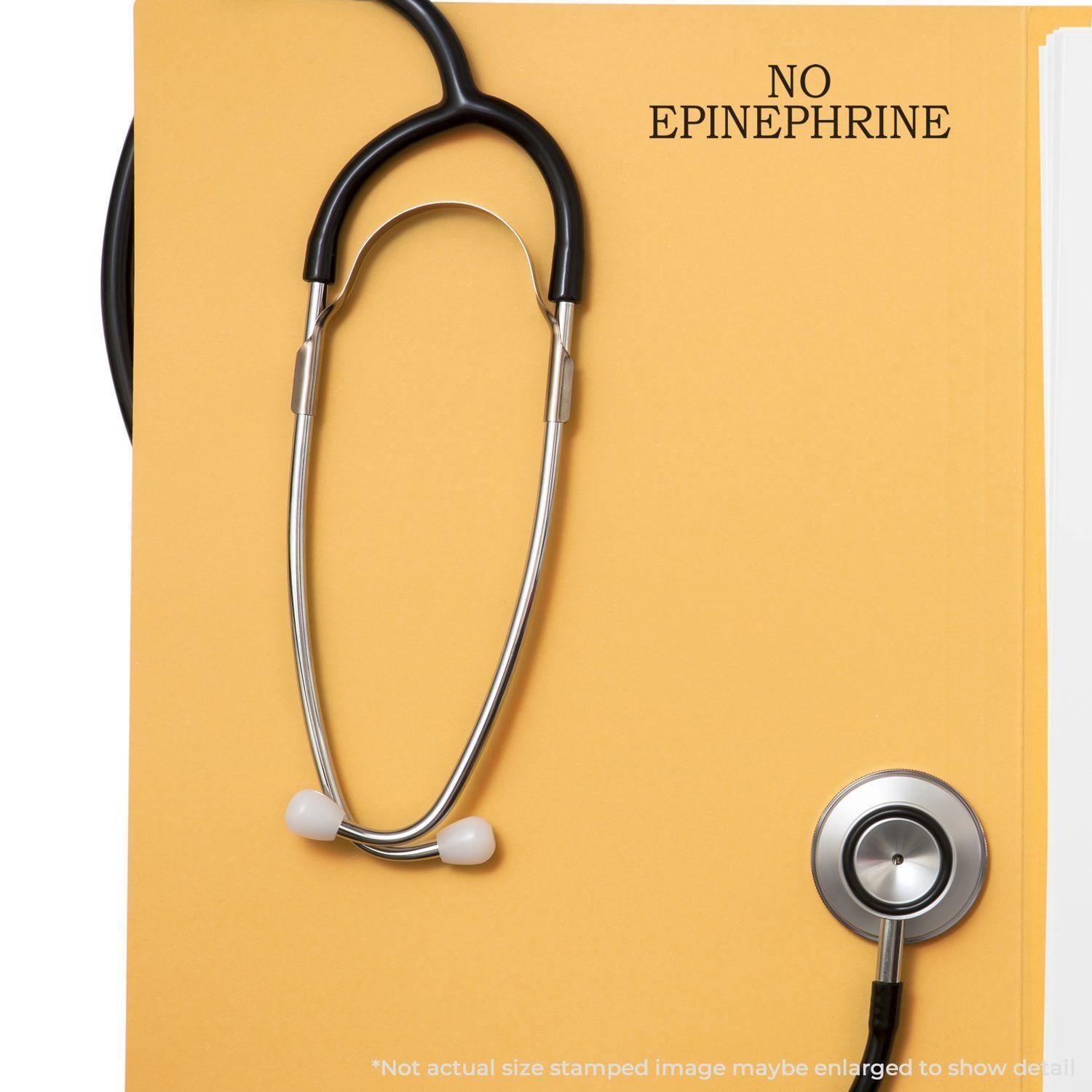 Large Pre-Inked No Epinephrine Stamp used on a yellow folder with a stethoscope placed on top.