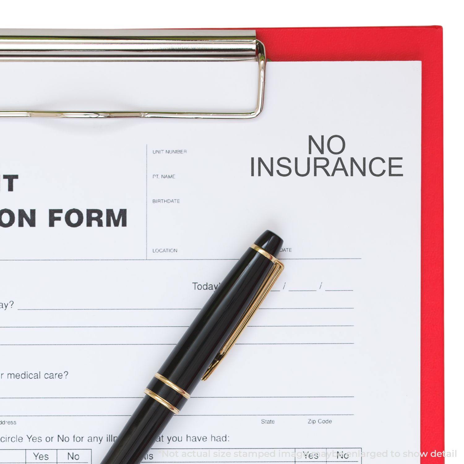 A clipboard with a medical form stamped NO INSURANCE using the Large Pre-Inked No Insurance Stamp, with a black pen placed on the form.