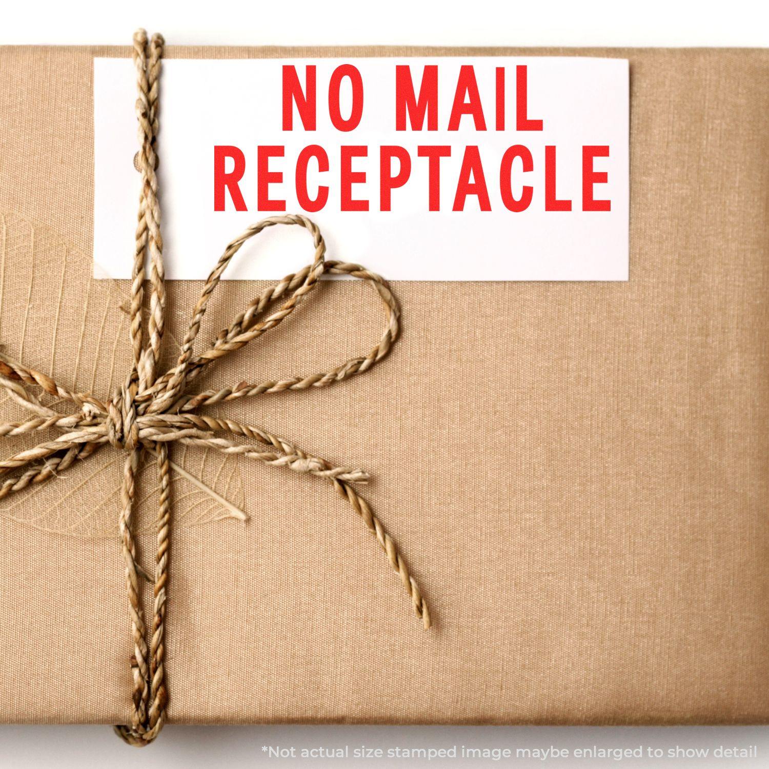 A package wrapped in brown paper with a NO MAIL RECEPTACLE label stamped using a Slim Pre-Inked No Mail Receptacle Stamp.