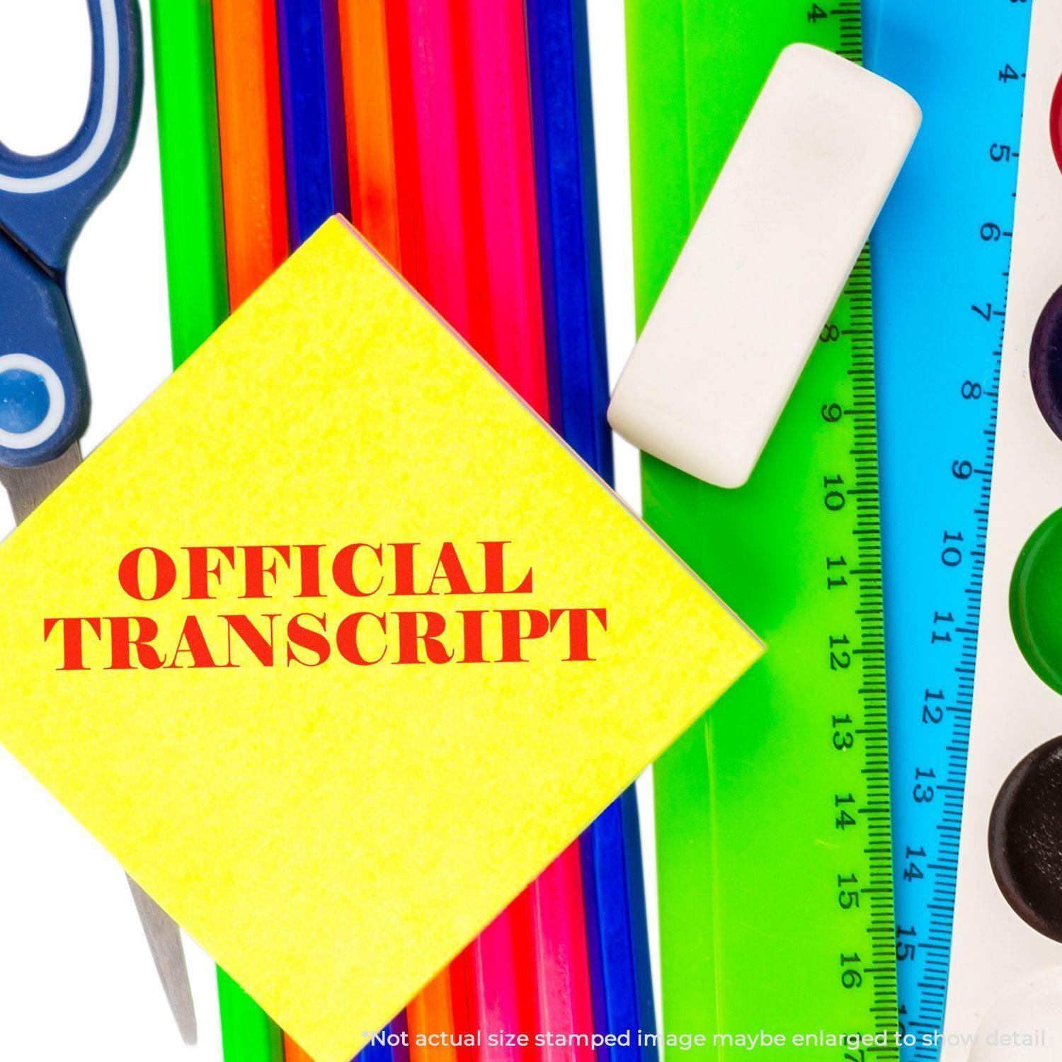 A Large Official Transcript Rubber Stamp is shown on a yellow paper among colorful stationery items like scissors, rulers, and markers.