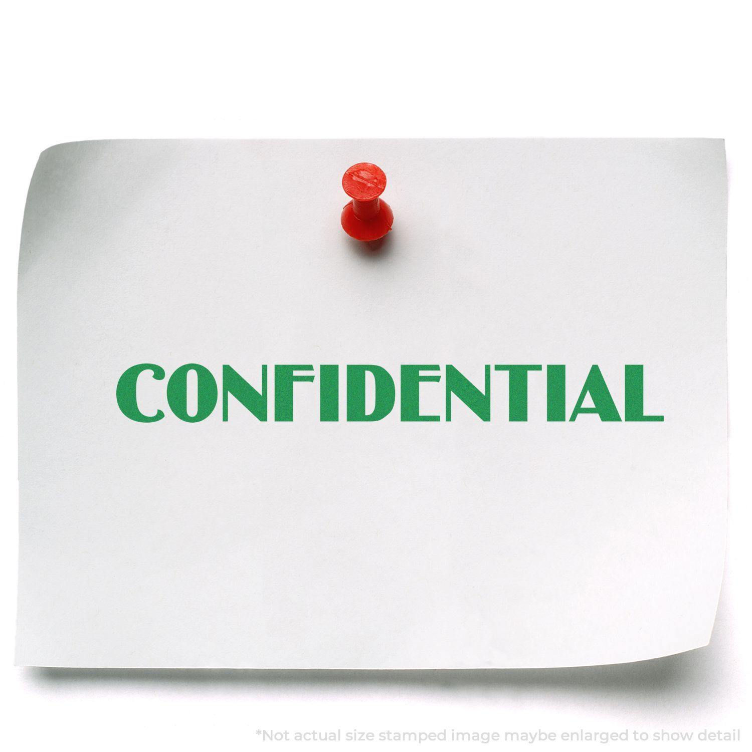 A white paper with CONFIDENTIAL stamped in green using the Large Optima Confidential Rubber Stamp, pinned with a red pushpin.