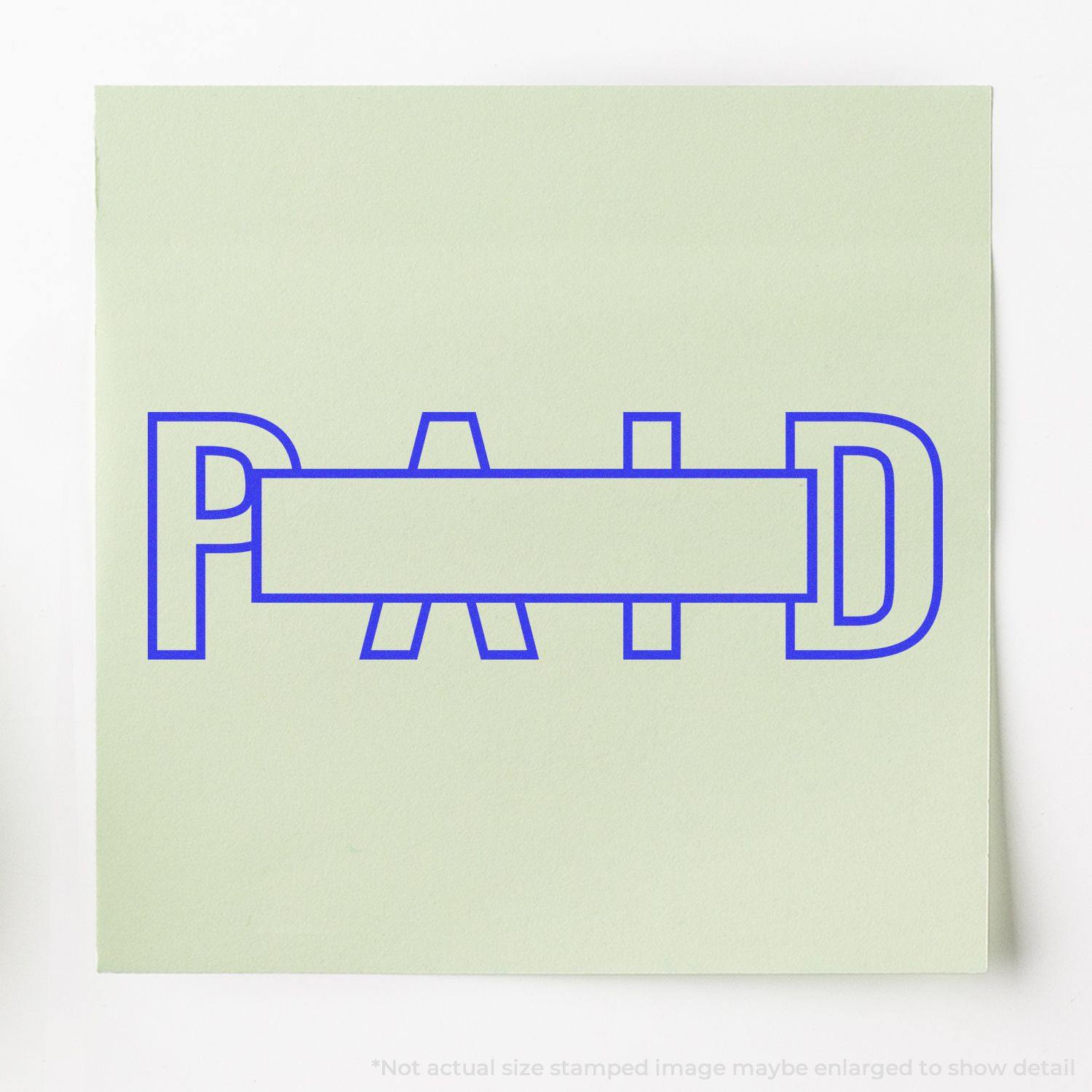 Slim Pre-Inked Outline Paid with Box Stamp in blue ink on a light green paper, showing the word PAID with a rectangular box in the center.