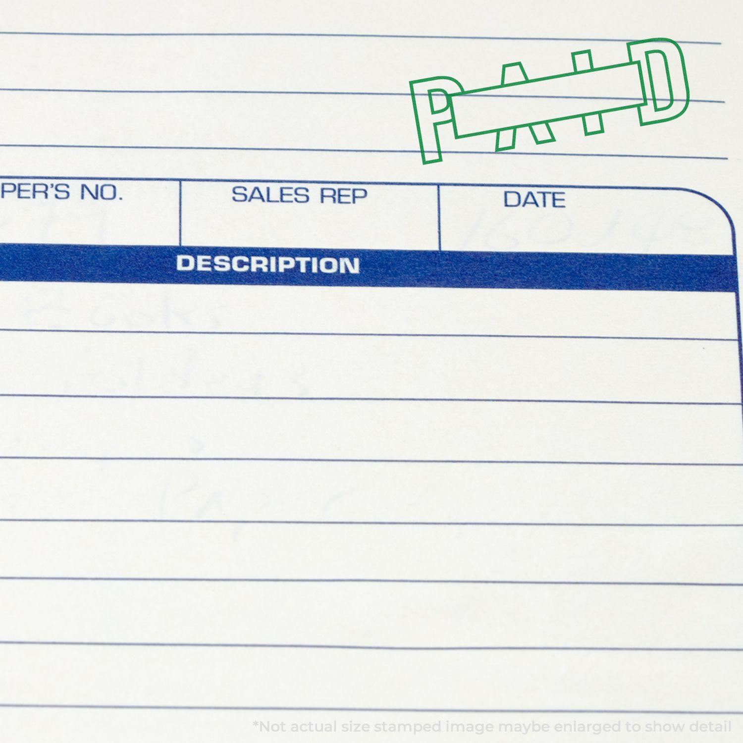 Slim Pre-Inked Outline Paid with Box Stamp in green ink on a document with sections for sales rep, date, and description.