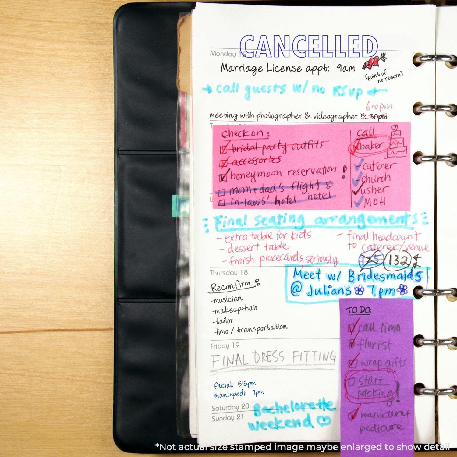 A planner page with a Slim Pre-Inked Outline Cancelled Stamp marking a marriage license appointment as CANCELLED in blue ink.