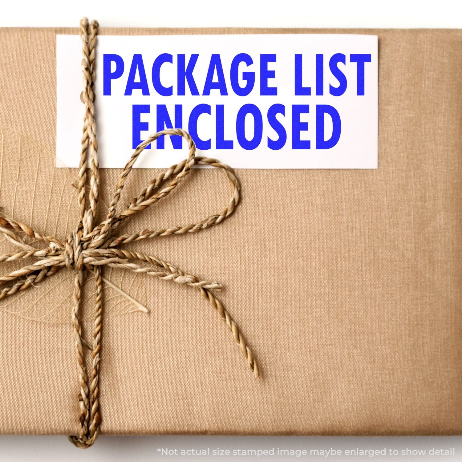 A brown package with a twine bow and a PACKAGE LIST ENCLOSED label stamped using the Self Inking Package List Enclosed Shipping Stamp.