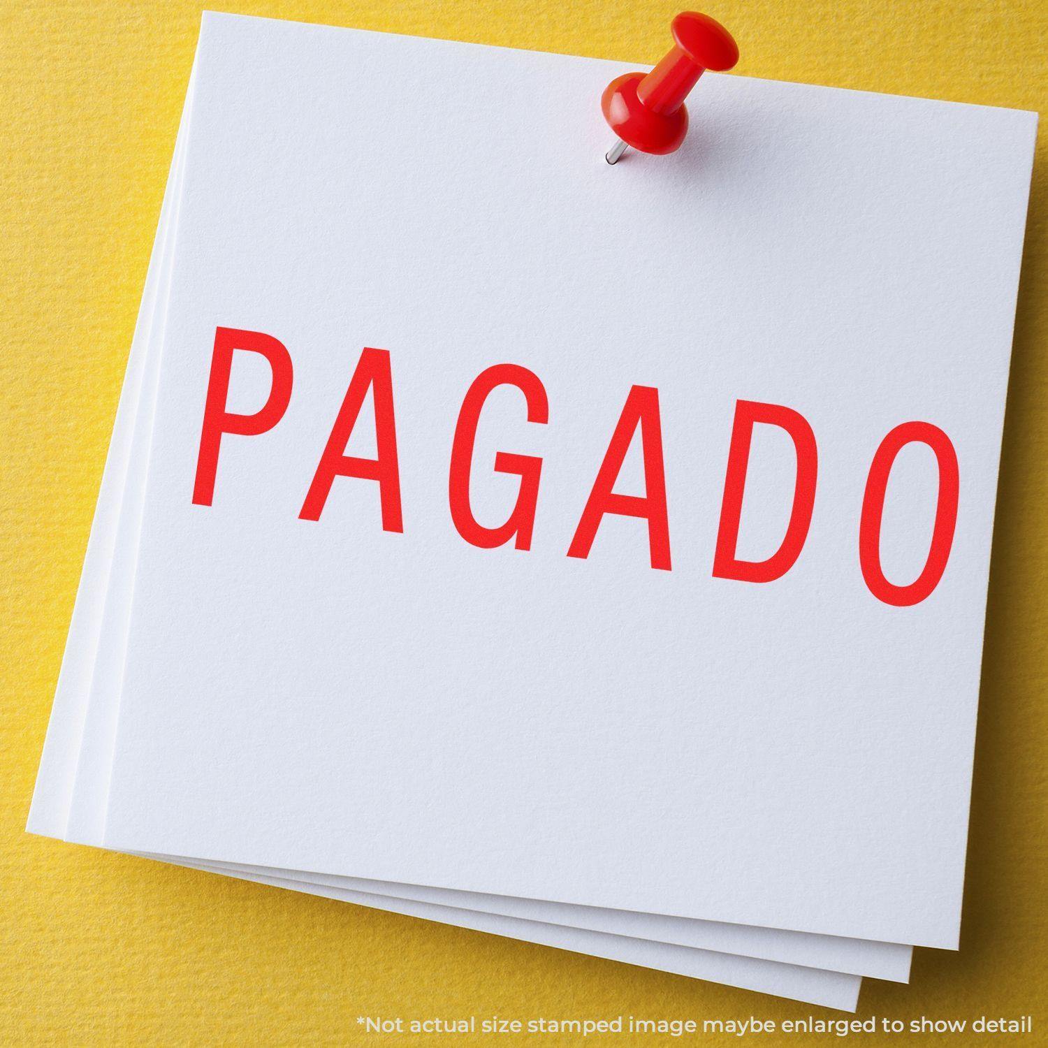 Large Pre-Inked Pagado Stamp in red ink on white paper, pinned with a red pushpin on a yellow background.