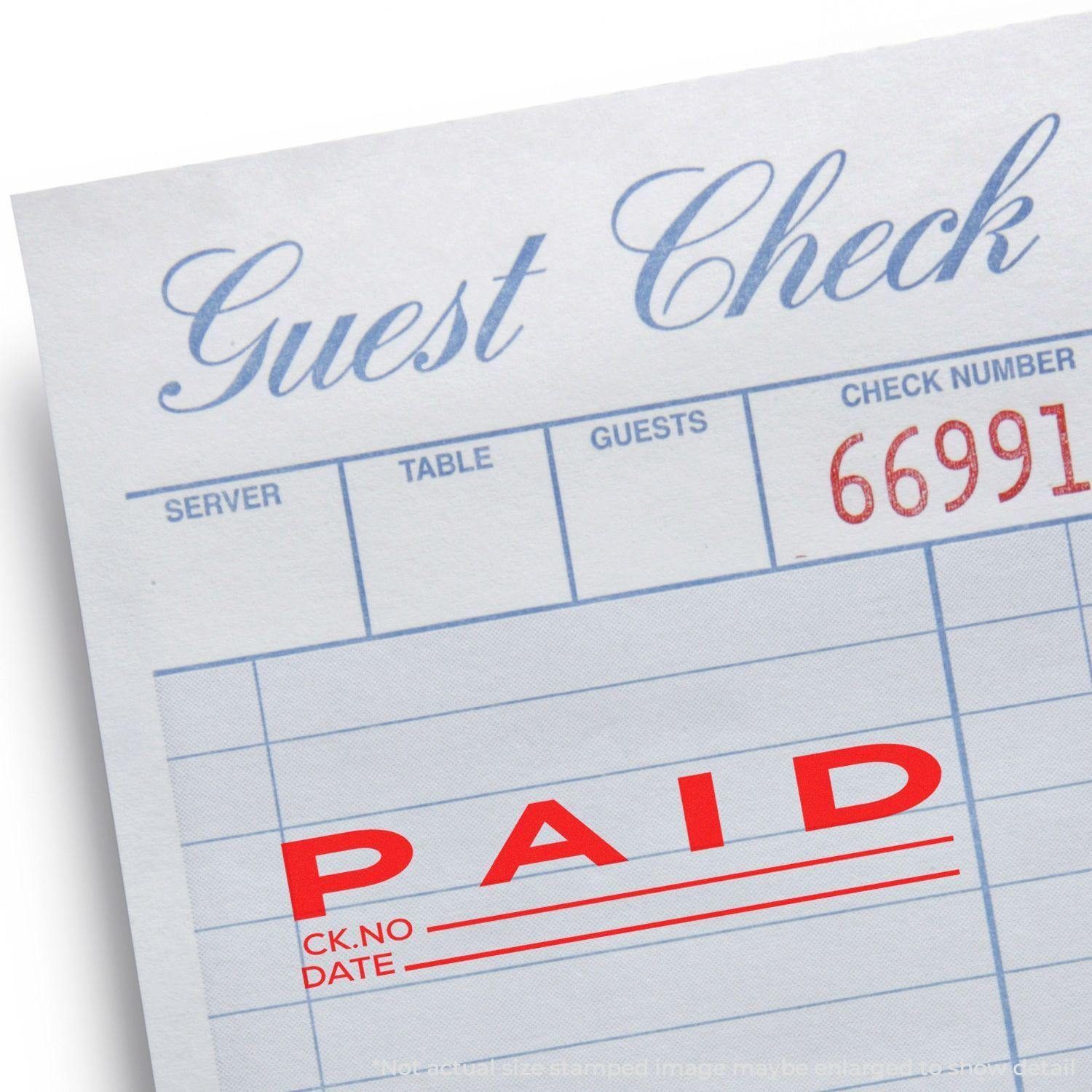 Guest check stamped with Large Self Inking Paid with Ck No Stamp in red ink, showing PAID and spaces for check number and date.