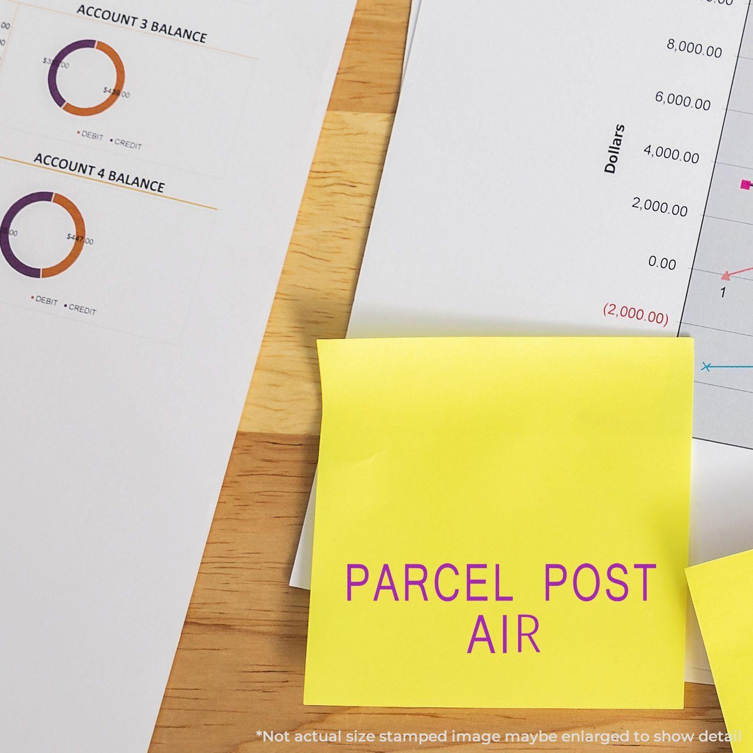 Slim Pre-Inked Parcel Post Air Stamp on a yellow sticky note, surrounded by financial documents and charts.