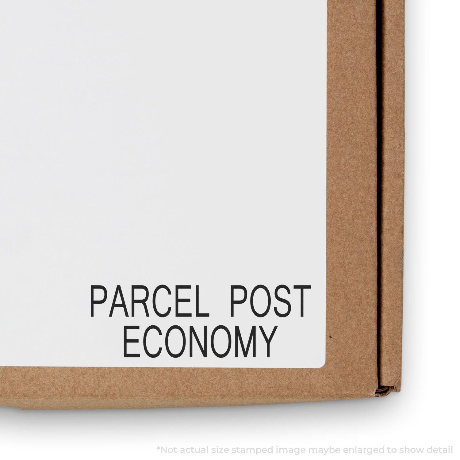 Large Parcel Post Economy Rubber Stamp used on a cardboard box, displaying the text 'PARCEL POST ECONOMY' in black letters.