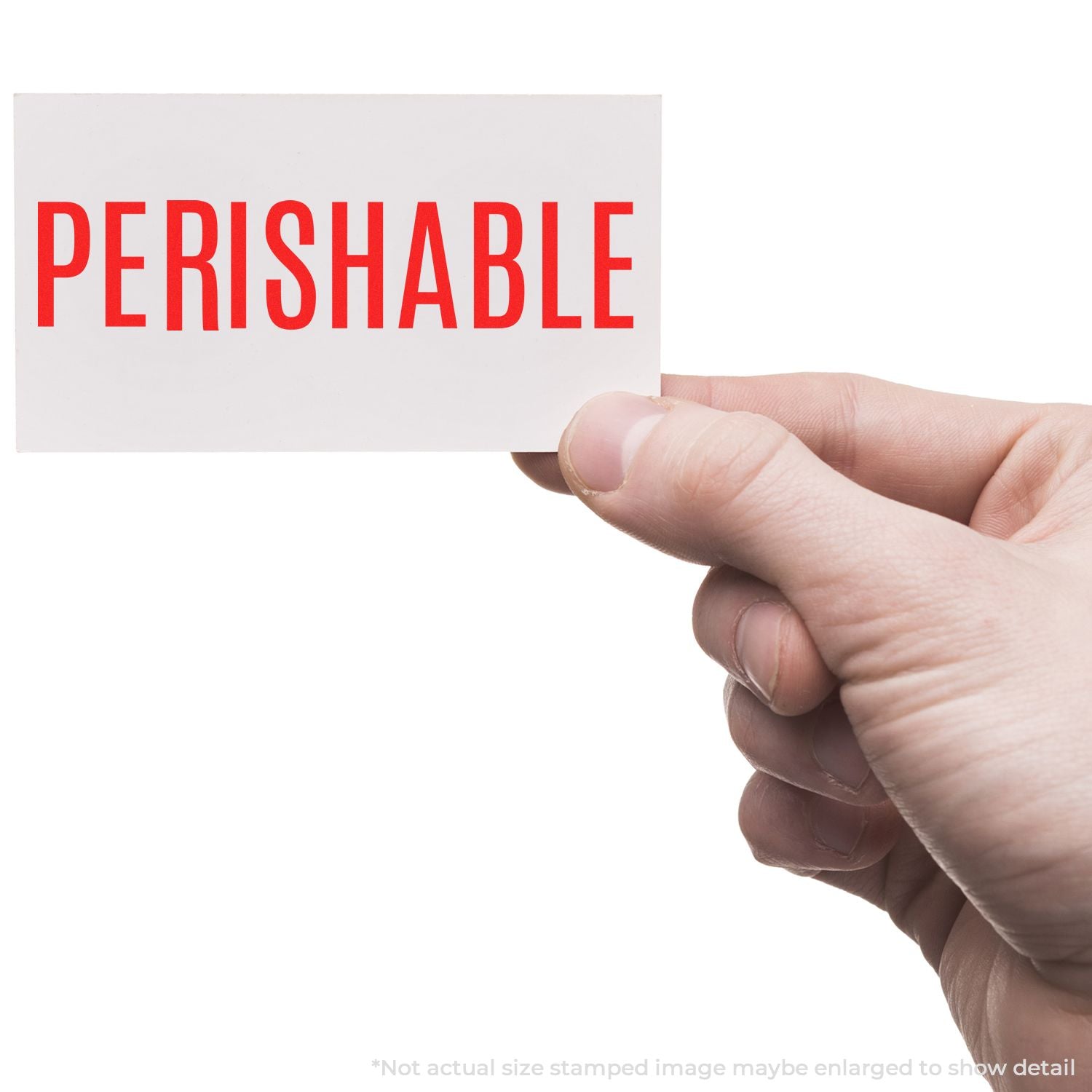 A hand holding a white card stamped with PERISHABLE in red using the Self Inking Perishable Stamp.