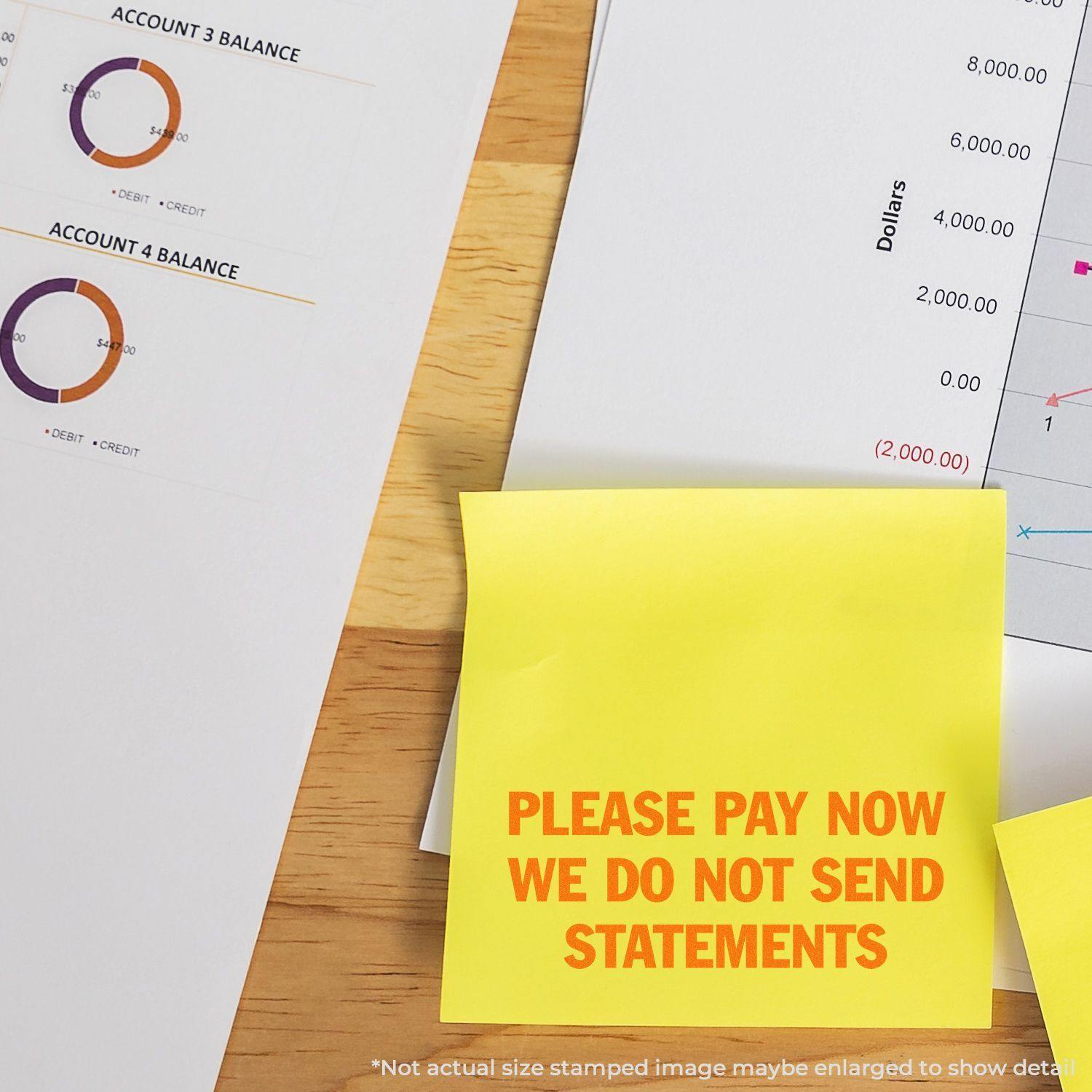 Large Please Pay Now No Statements Rubber Stamp used on a yellow sticky note, placed on financial documents with charts and graphs.