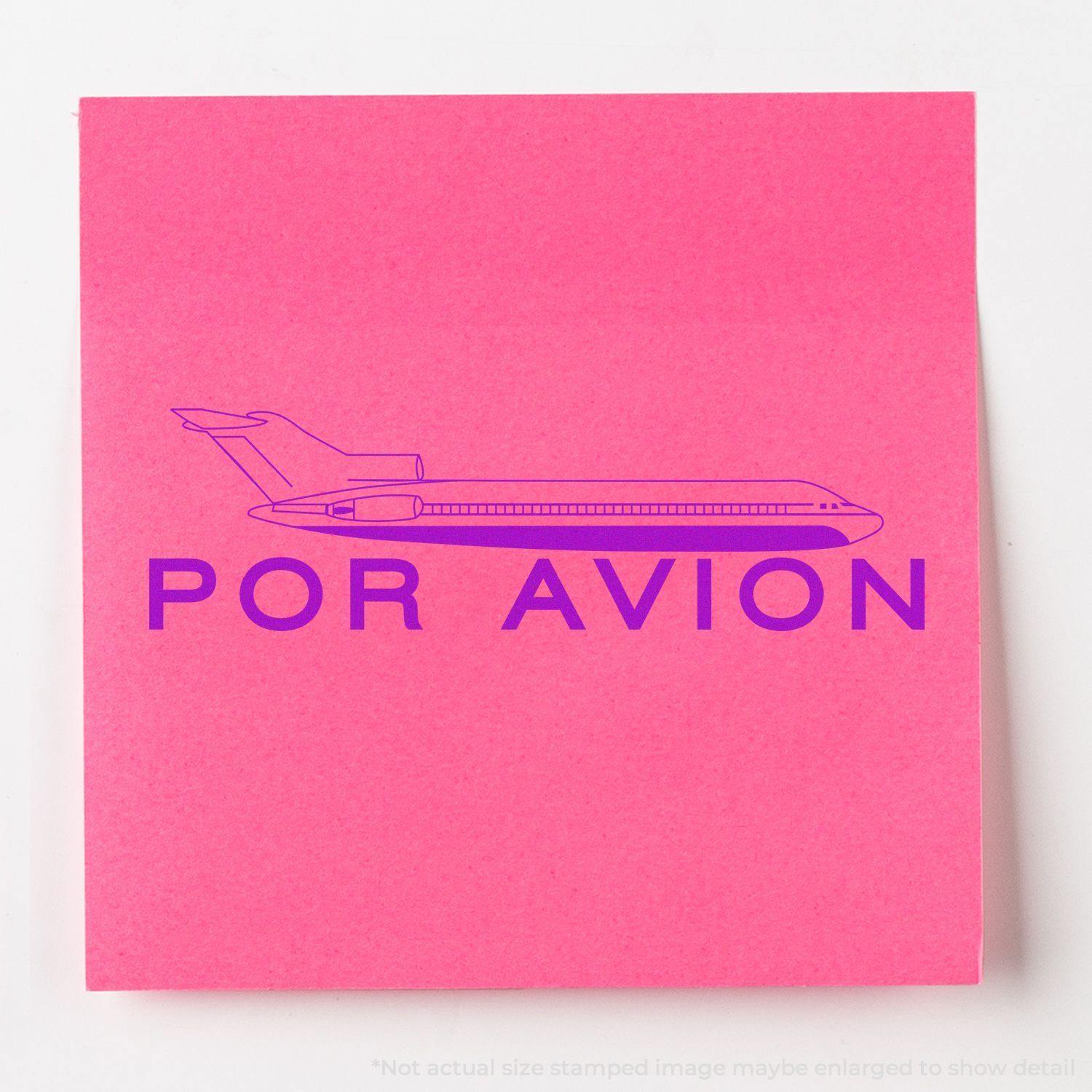 Pink paper with a stamped image of an airplane and the text POR AVION in purple, created using a Slim Pre-Inked Por Avion Stamp.