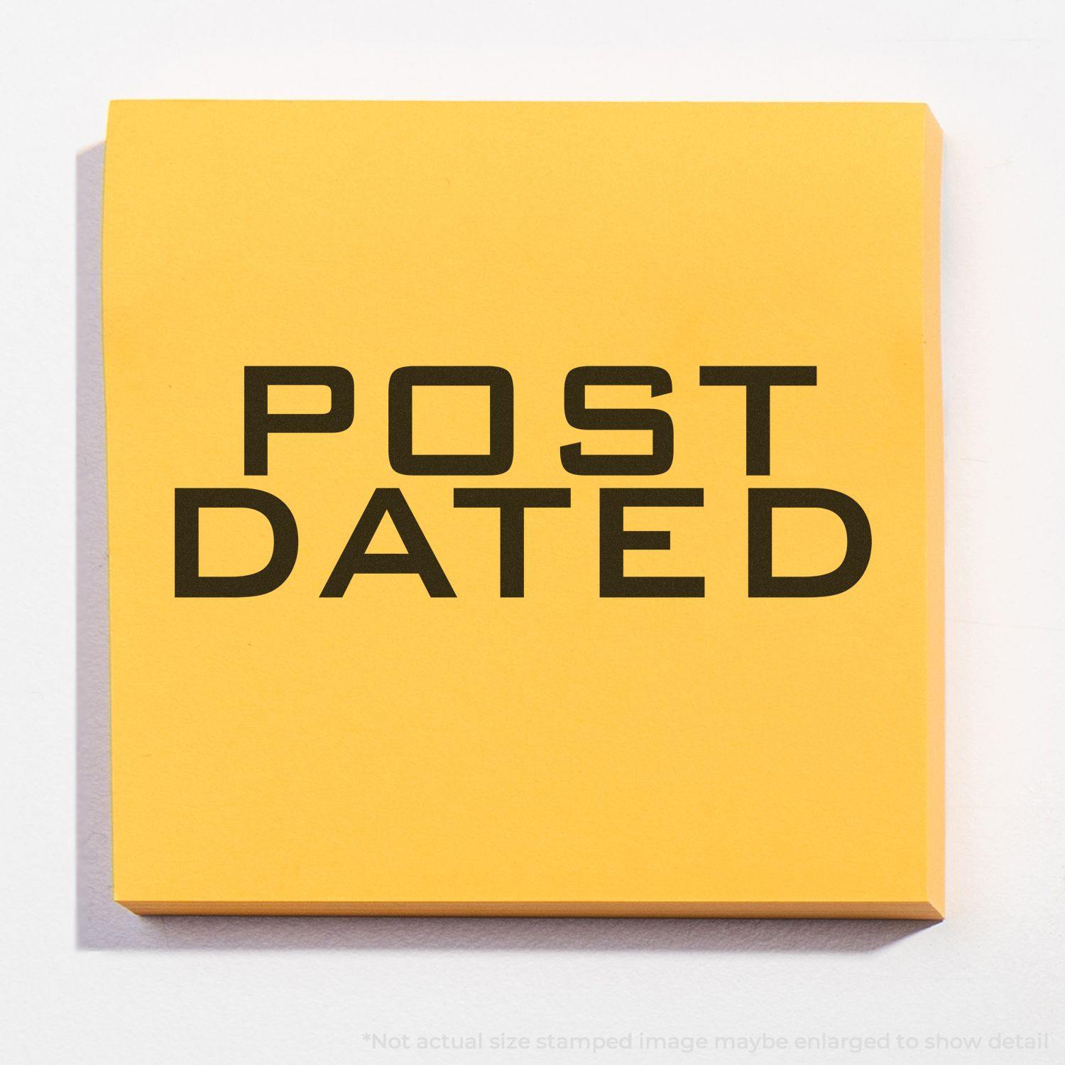 Large Post Dated Rubber Stamp imprint on a yellow sticky note, displaying the text POST DATED in bold black letters.