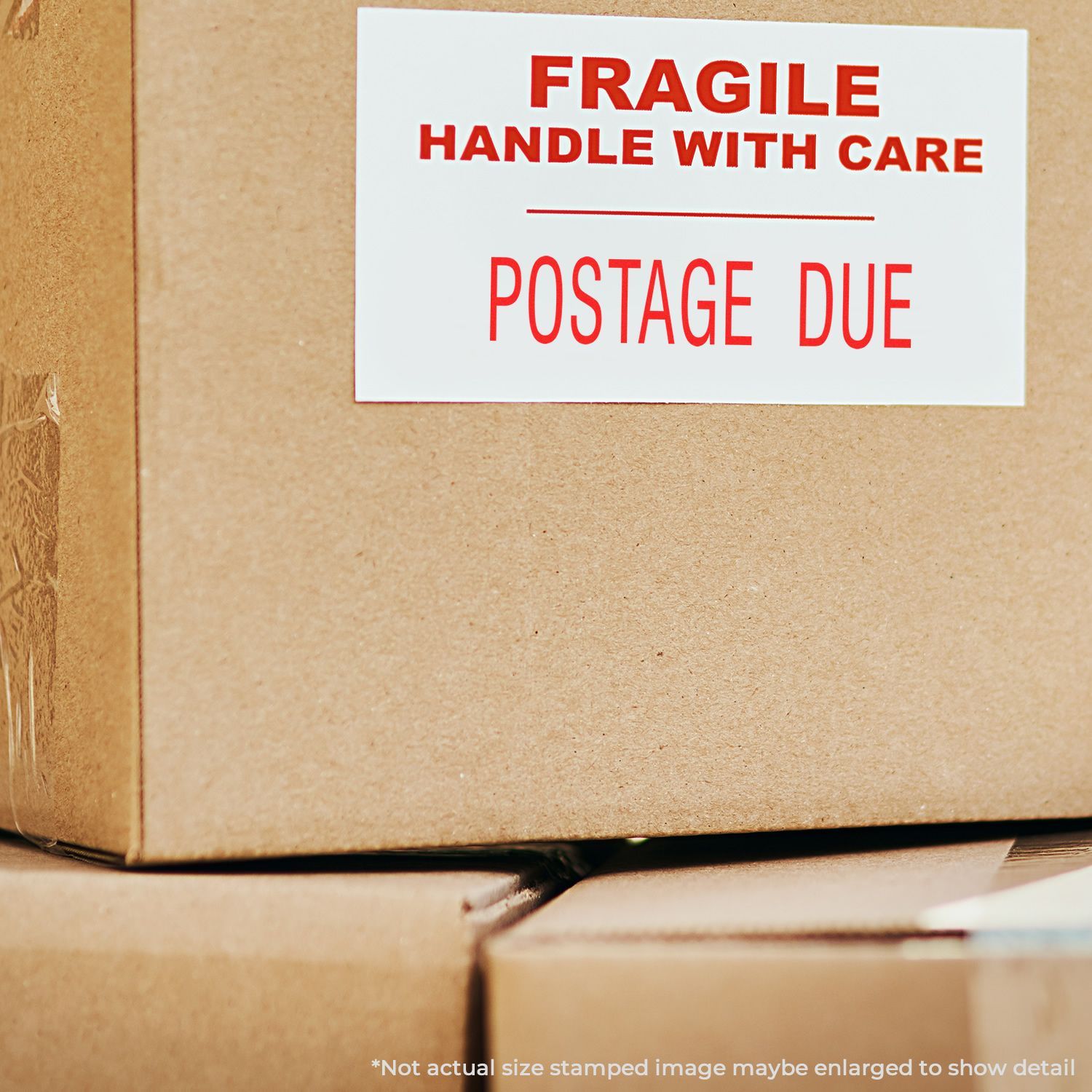 Cardboard boxes with a FRAGILE HANDLE WITH CARE and POSTAGE DUE label stamped using a Self Inking Postage Due Stamp.