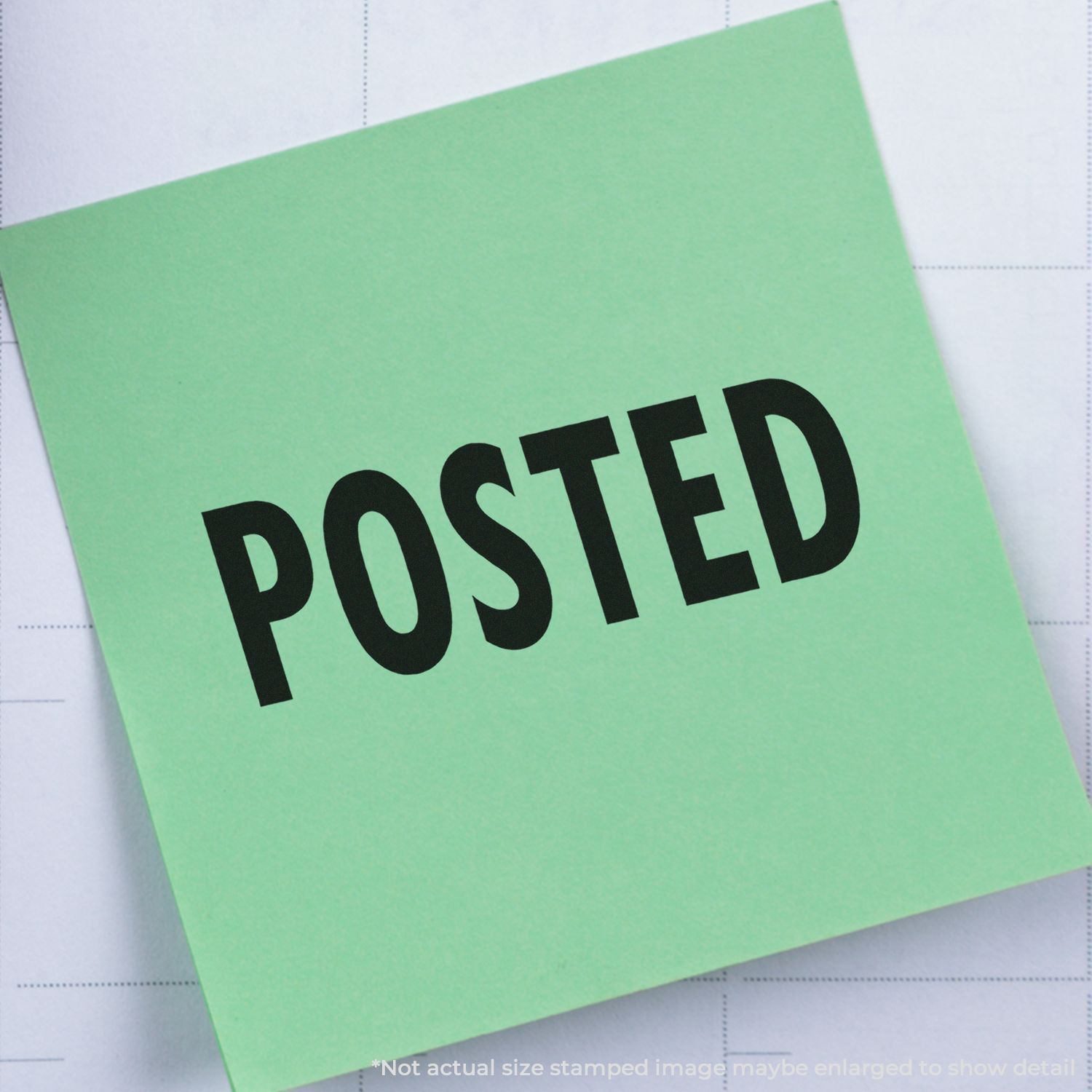 Self Inking Posted Stamp marking "POSTED" in bold black letters on a green paper, placed on a white background.