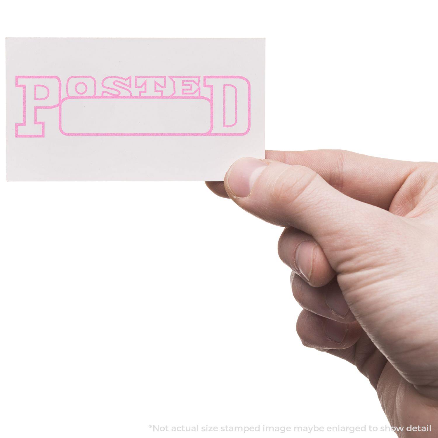 A hand holding a card stamped with POSTED in pink using the Large Posted with Date Box Rubber Stamp.