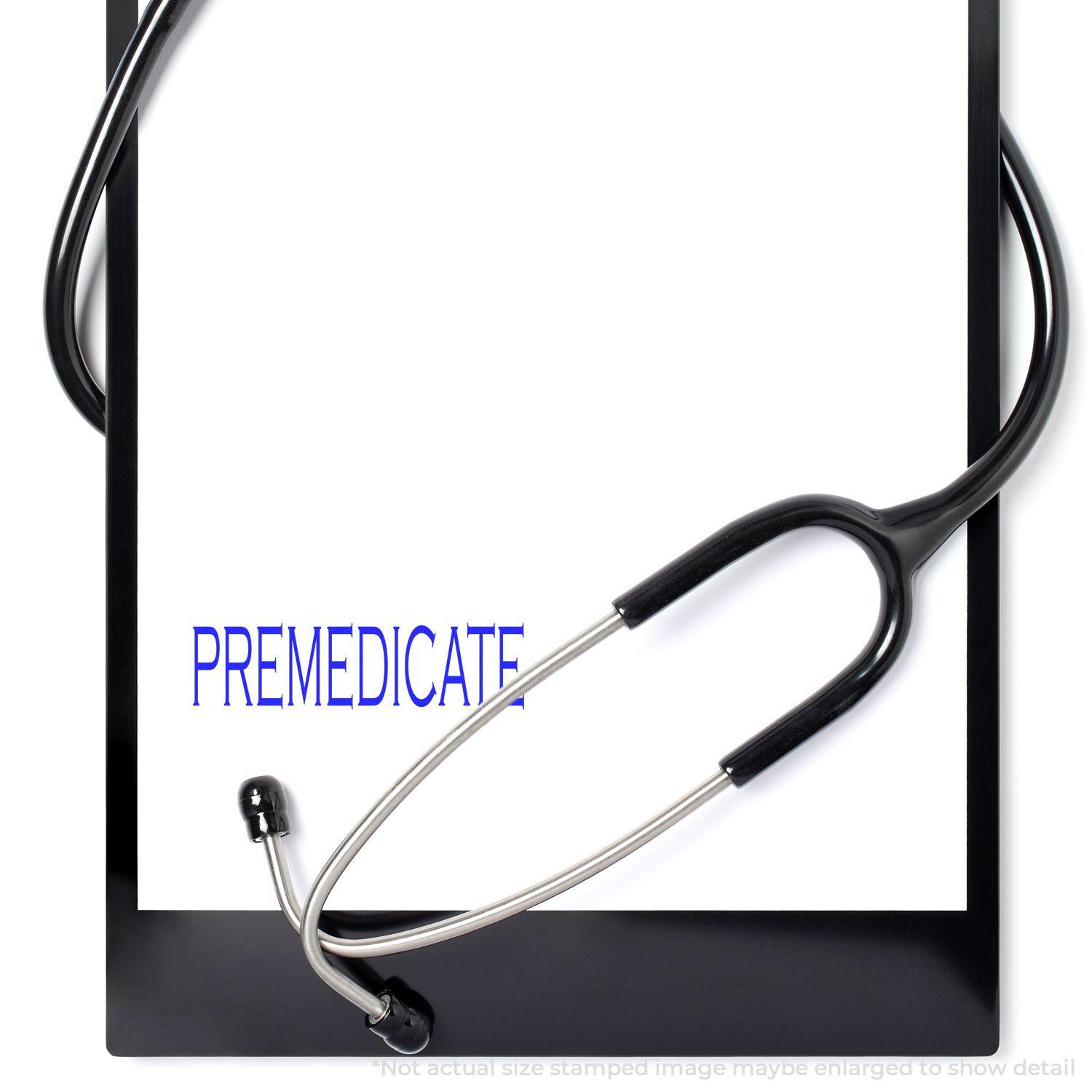 Slim Pre-Inked Premedicate Stamp used on a white paper with a stethoscope placed on a black clipboard.