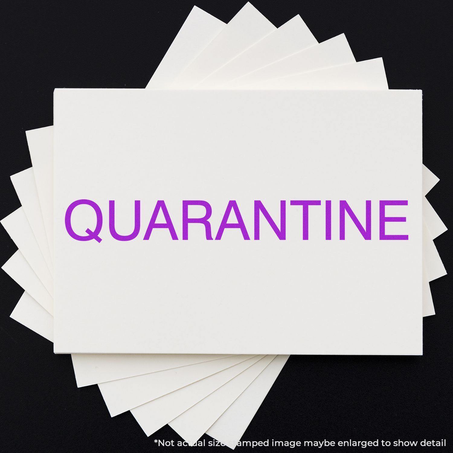 Large Pre-Inked Quarantine Stamp in purple ink on a white card, with multiple cards fanned out underneath on a black background.