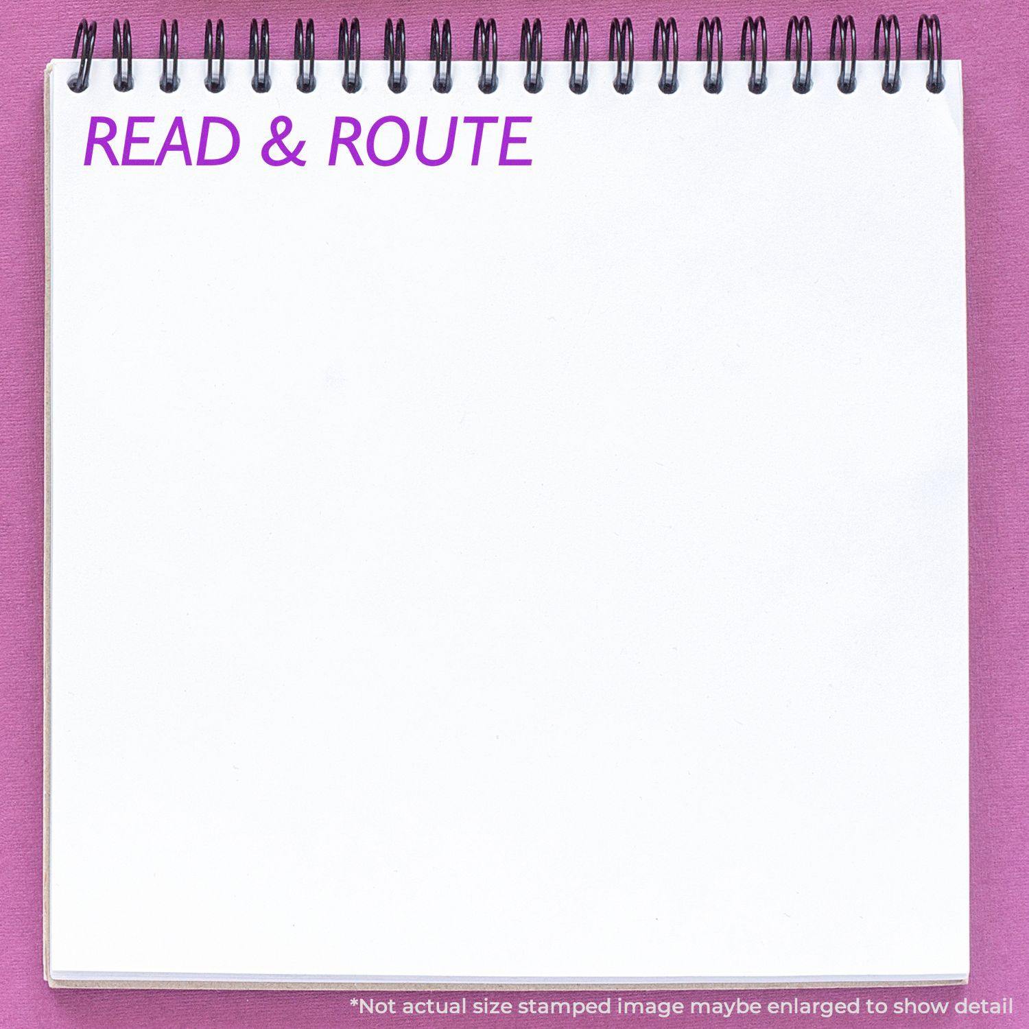 Large Self Inking Read & Route Stamp used on a white notepad with purple text READ & ROUTE on a pink background.