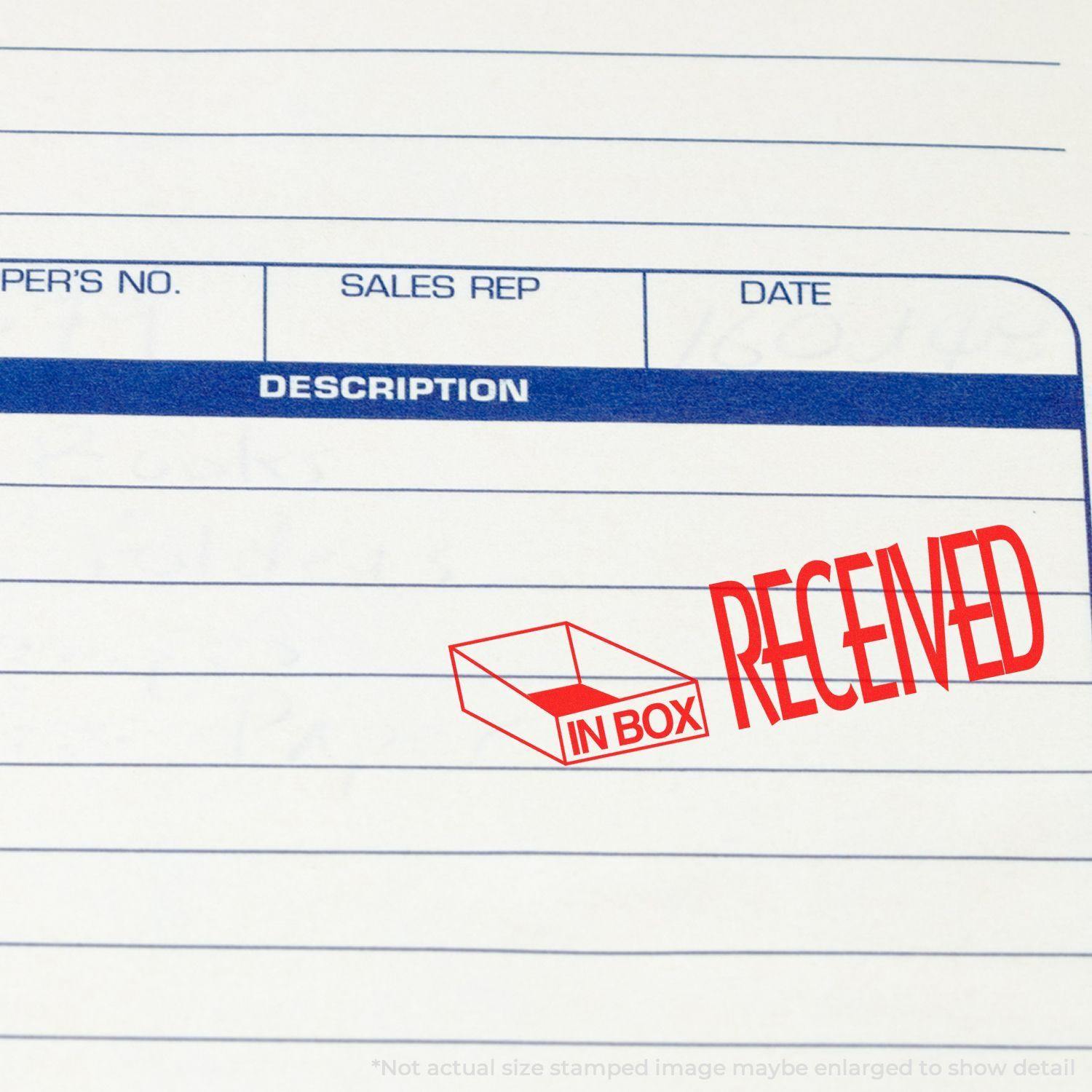 Large Self Inking Received with In Box Icon Stamp in red ink on a document, showing the IN BOX icon and RECEIVED text prominently.