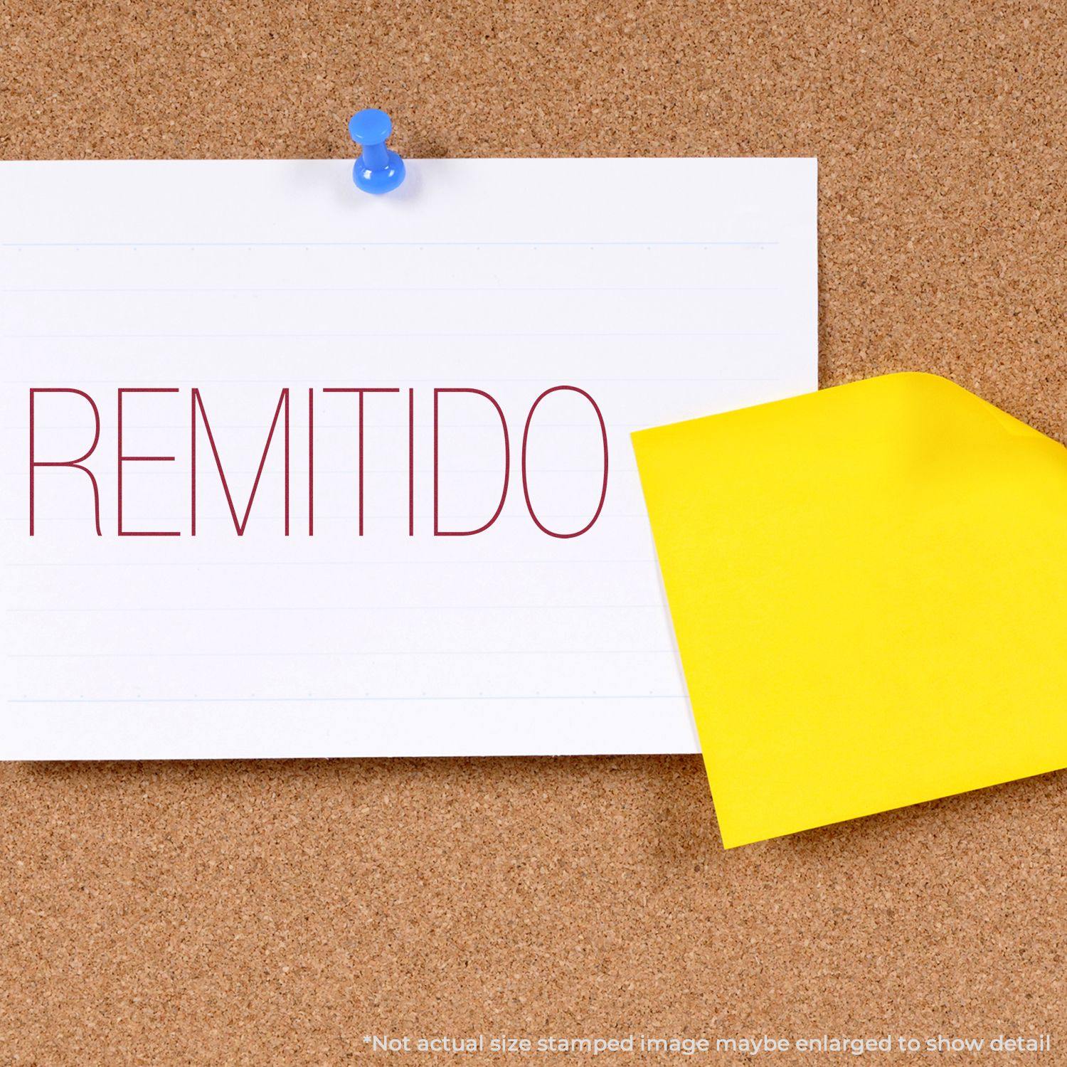 Large Self Inking Remitido Stamp used on a white paper pinned to a corkboard, with a yellow sticky note beside it.