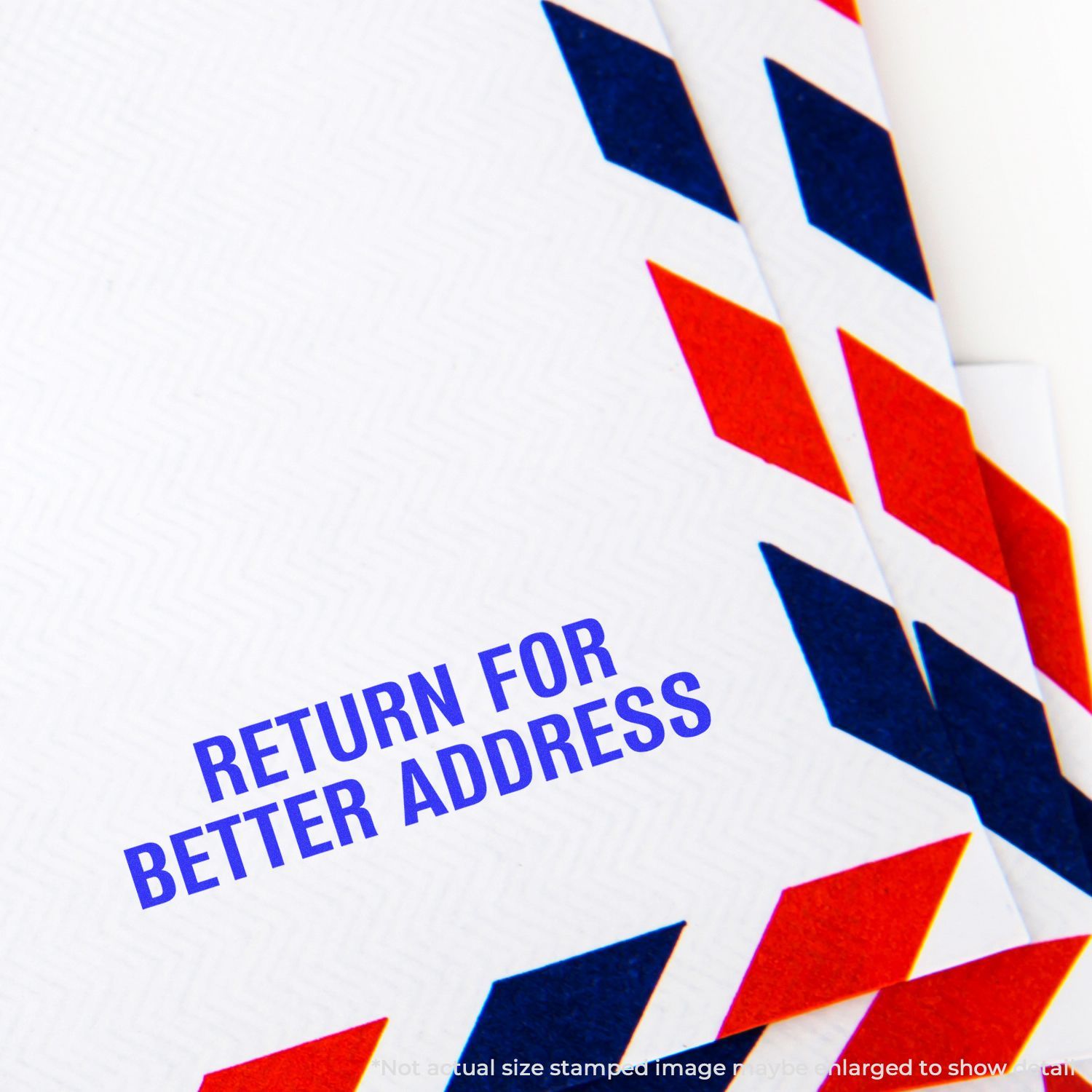 Envelope stamped with RETURN FOR BETTER ADDRESS using the Self Inking Return for Better Address Stamp, featuring red and blue chevron design.