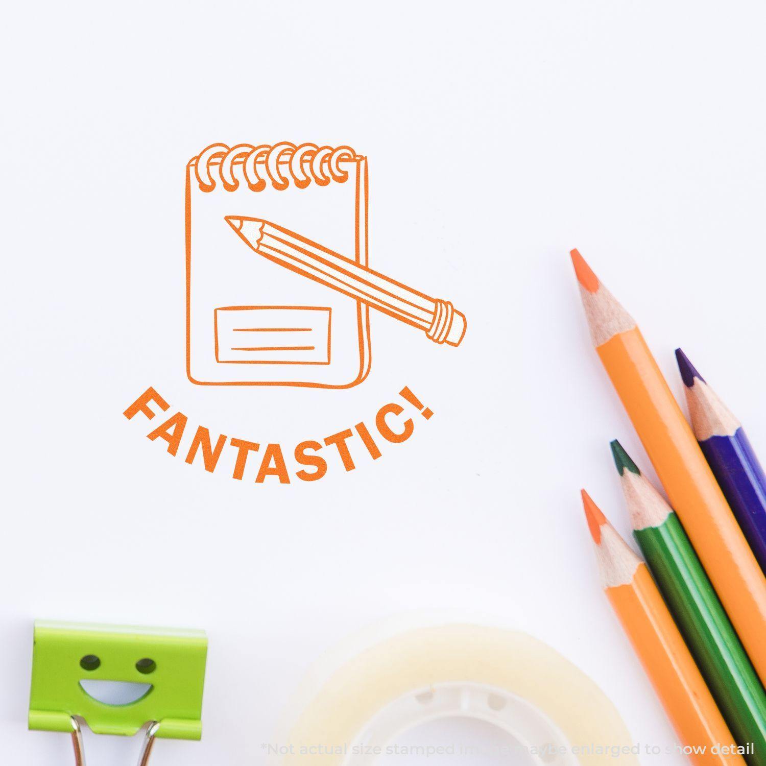 Round Fantastic Rubber Stamp with an orange design of a notepad and pencil, surrounded by colorful pencils and office supplies.