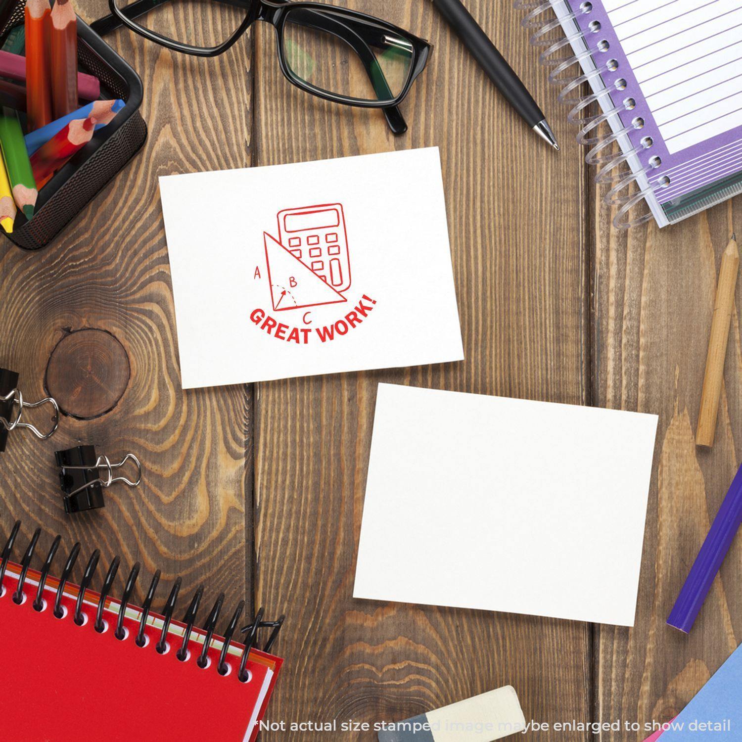 Round Great Work with Calculator Rubber Stamp on a white card, surrounded by office supplies on a wooden desk.