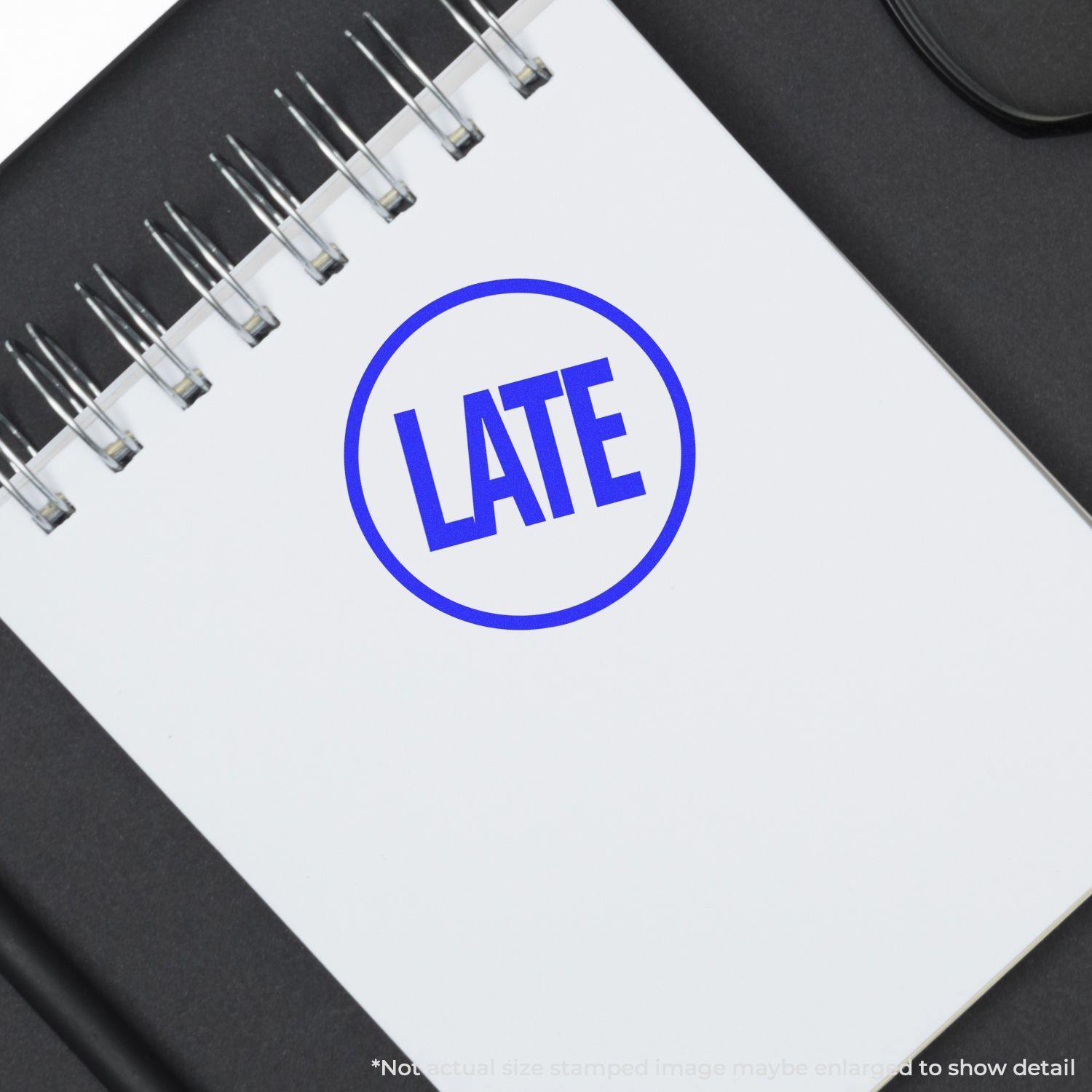 Round Late rubber stamp in blue ink on a white notepad, with the word 'LATE' prominently displayed in the center.