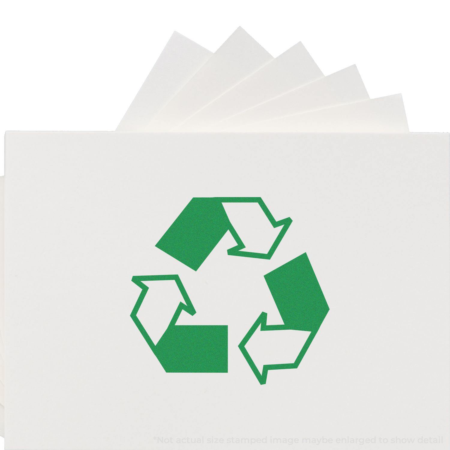 Round Recycle Rubber Stamp in use, showing a green recycling symbol stamped on white paper with multiple stamped impressions.