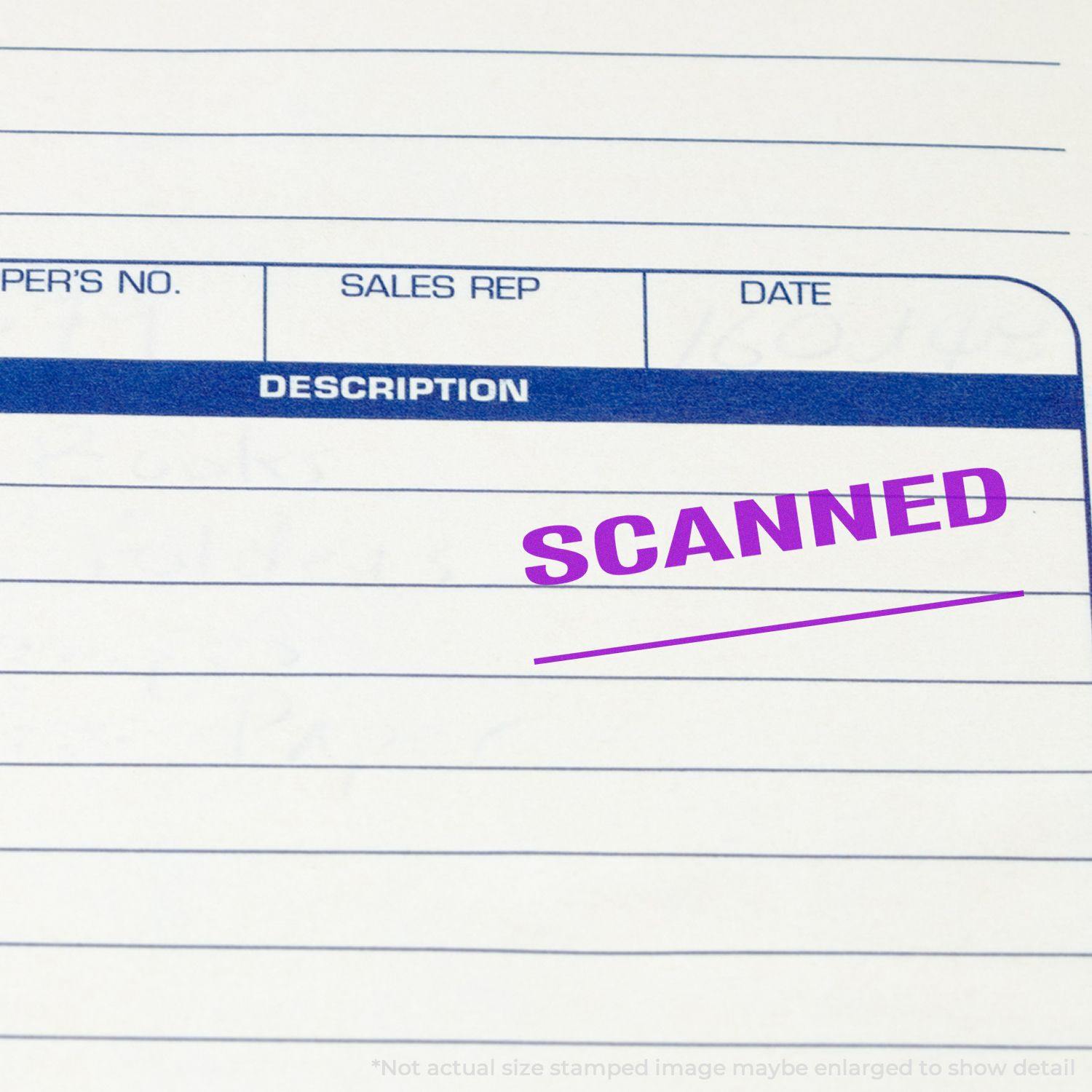 Close-up of a document stamped with a purple SCANNED mark using the Large Self Inking Scanned with Line Stamp.