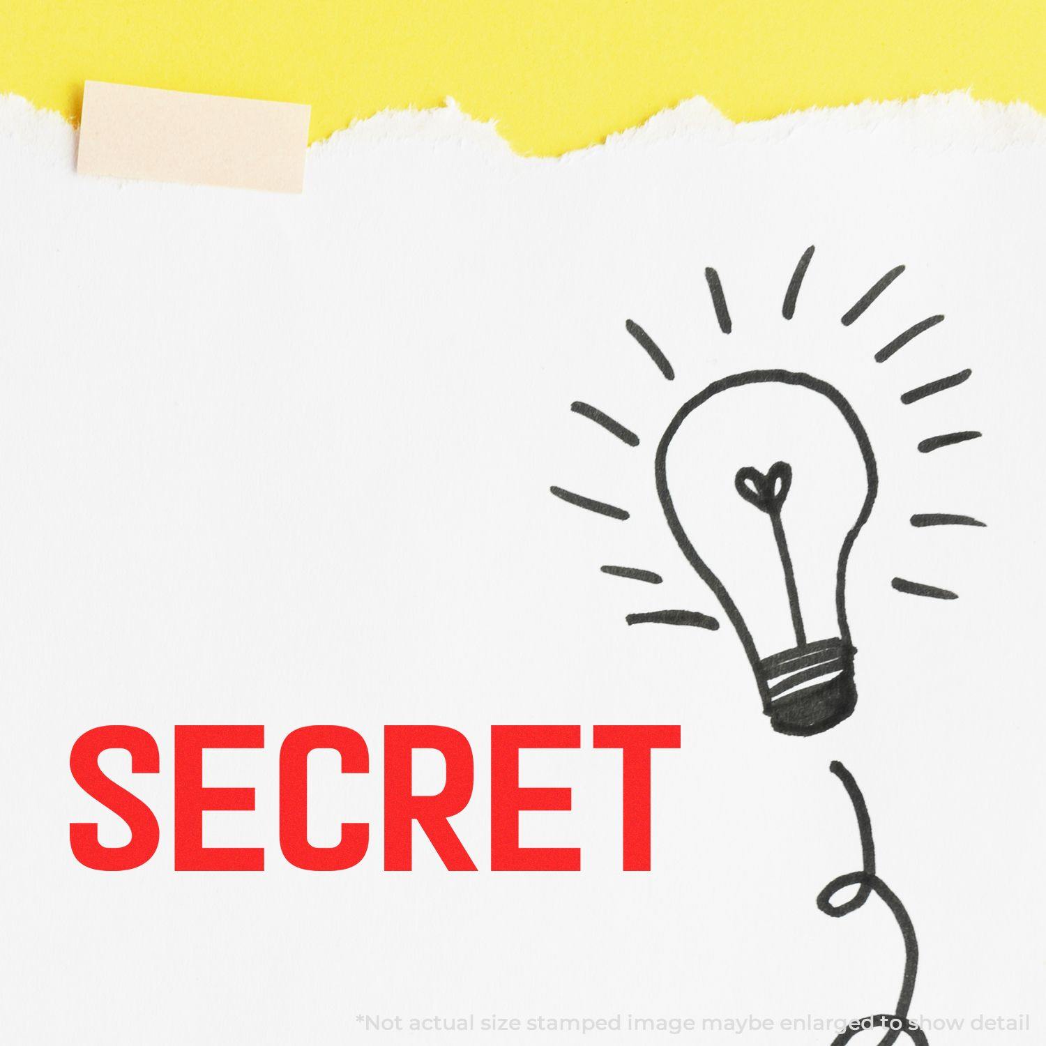 Large Pre-Inked Secret Stamp used on white paper with a lightbulb drawing and the word SECRET in bold red letters.