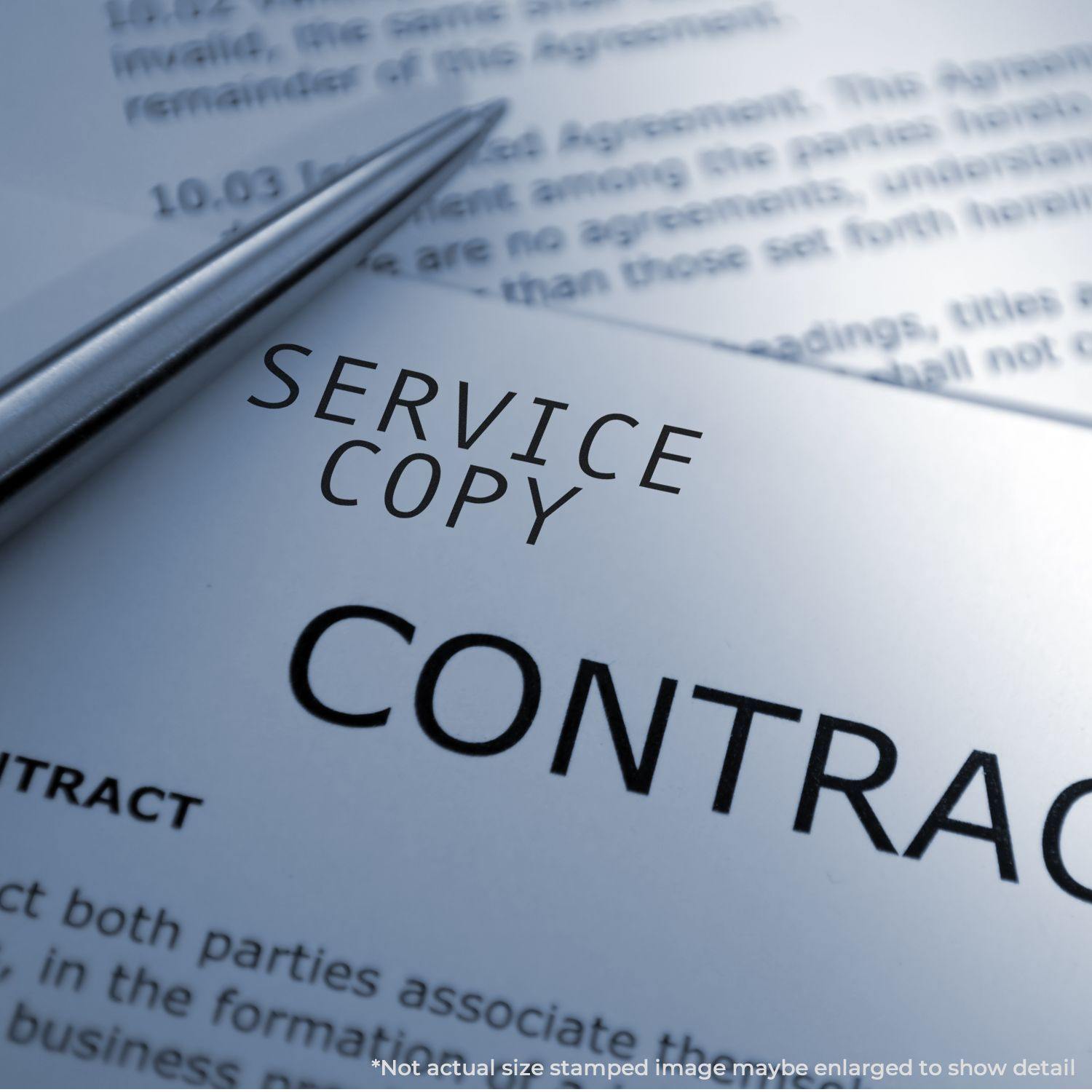 Self Inking Service Copy Stamp marking 'SERVICE COPY' on a contract document with a pen beside it.