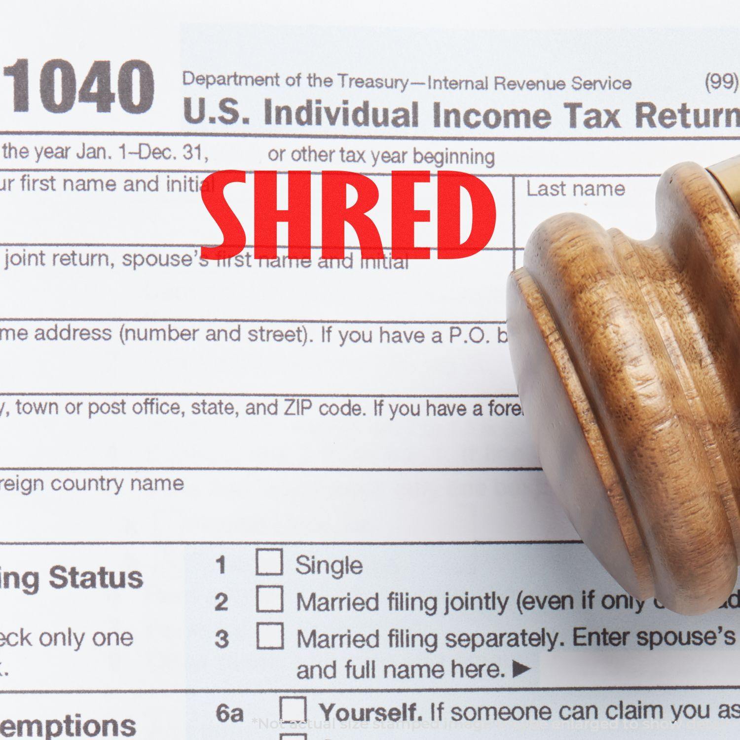 A Self Inking Shred Stamp is shown stamping the word SHRED in red ink on a U.S. Individual Income Tax Return form.