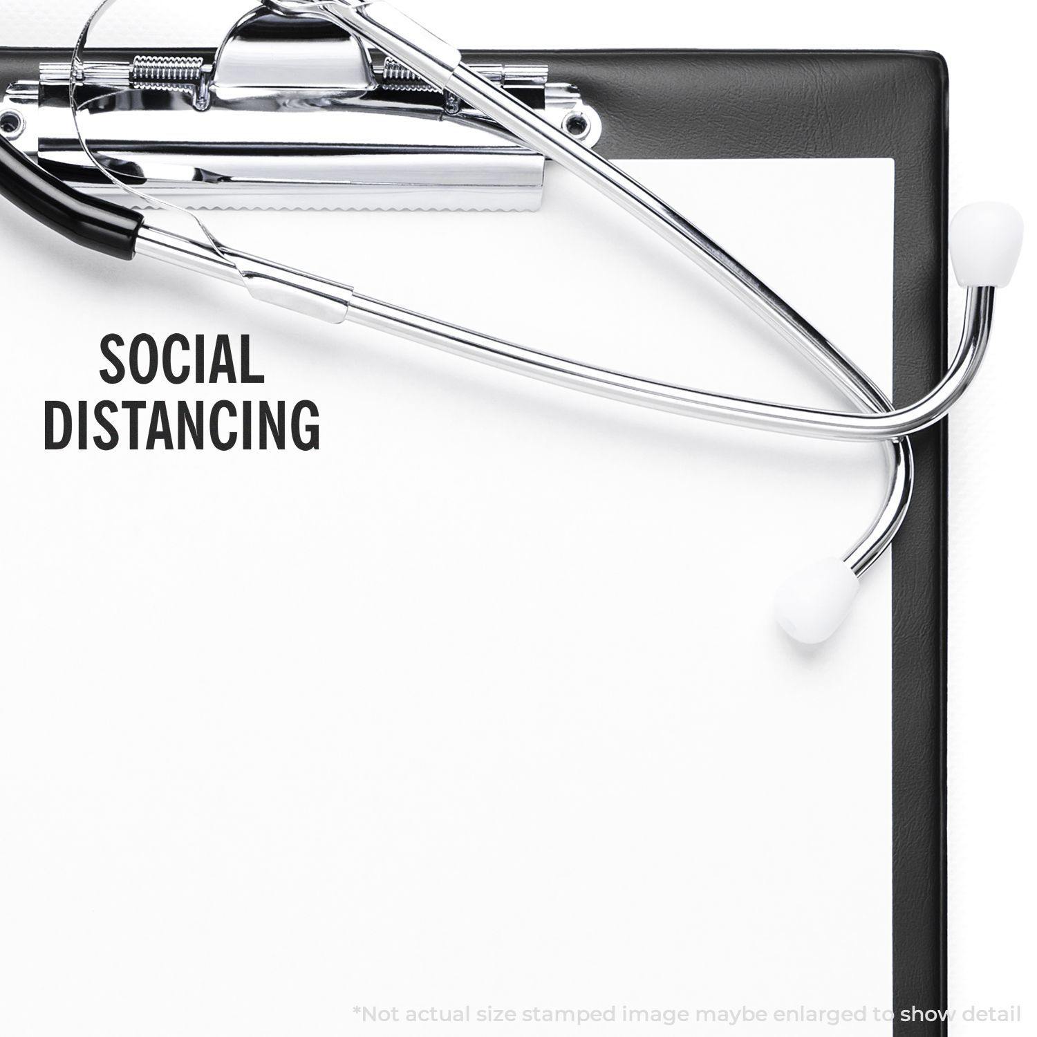 Clipboard with SOCIAL DISTANCING stamped using the Large Self Inking Social Distancing Stamp, stethoscope placed on top.