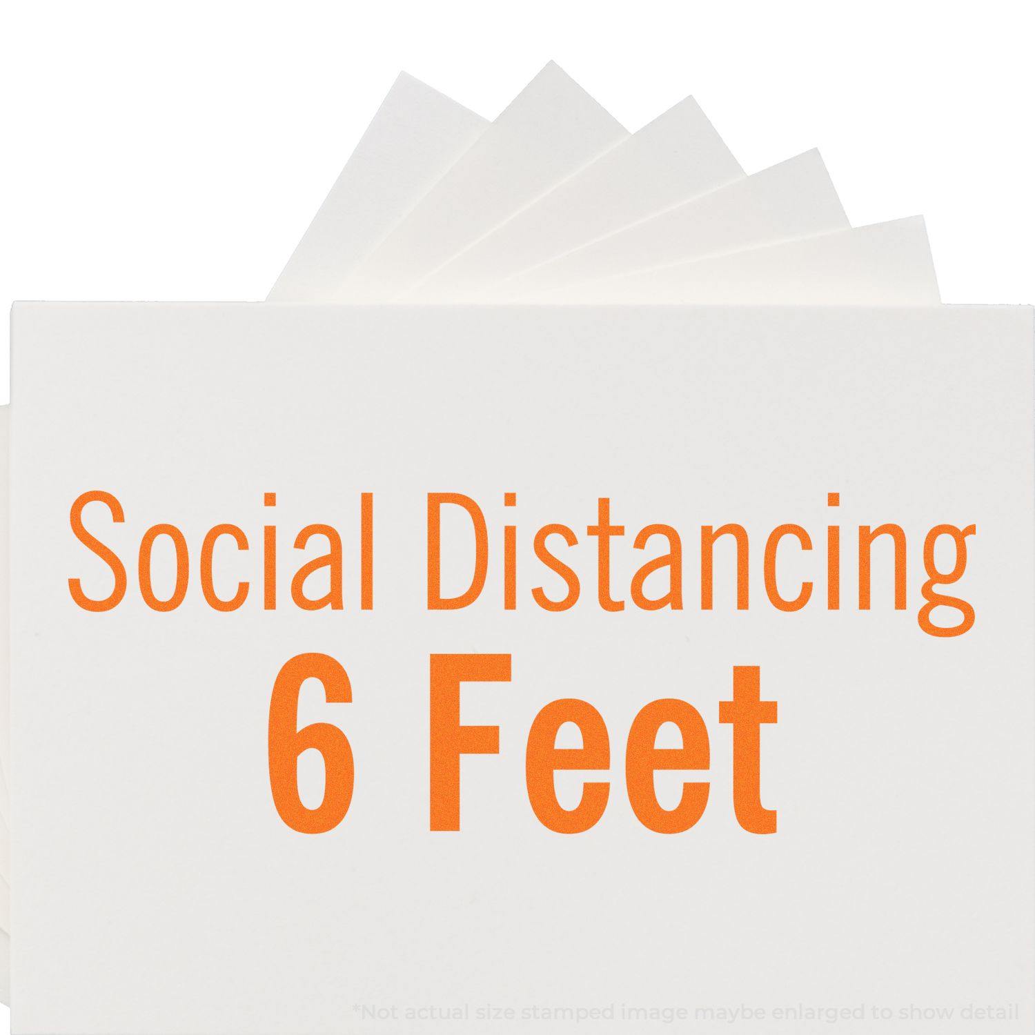 Large Social Distancing 6 Feet Self-Inking Stamp in use, displaying Social Distancing 6 Feet in bold orange text on a white background.