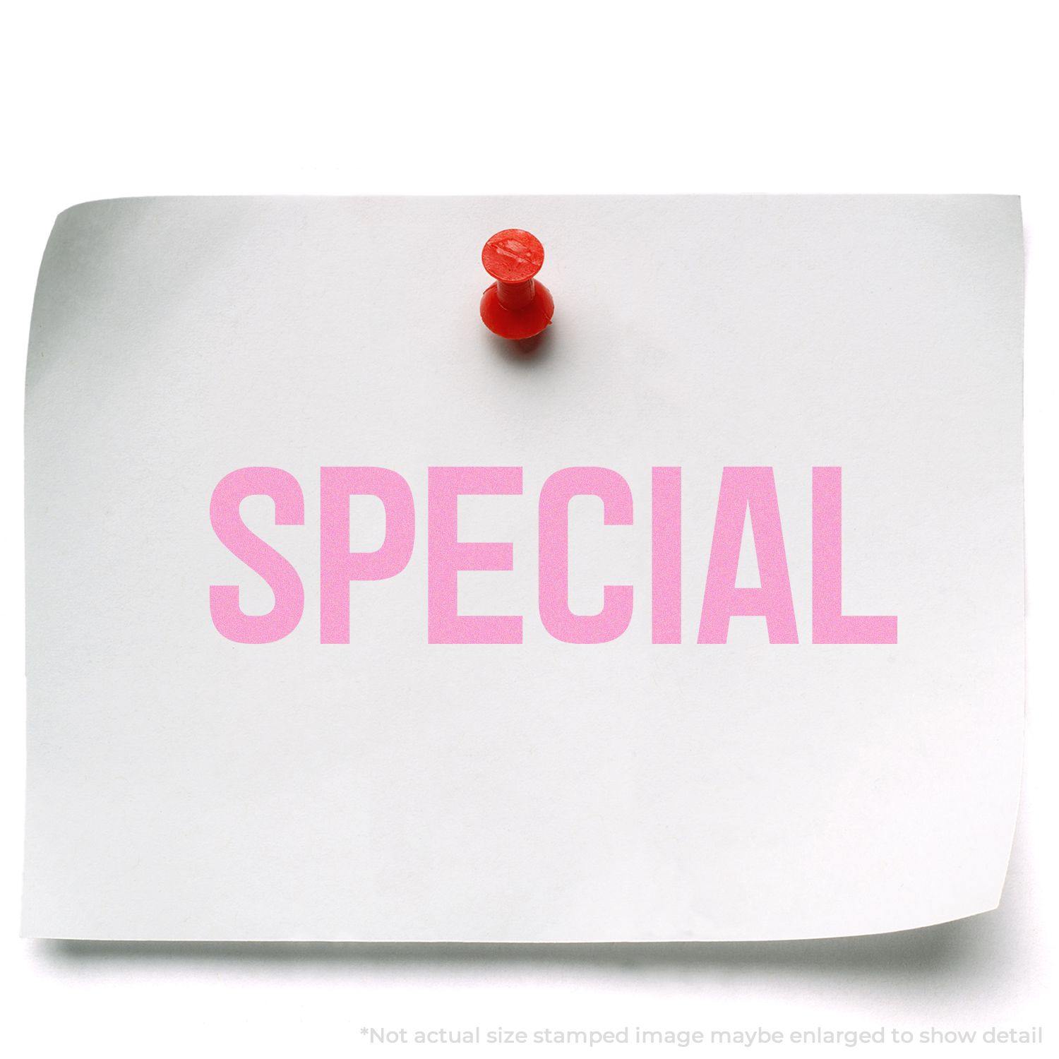 A piece of paper pinned to a board with the word "SPECIAL" stamped in pink using the Slim Pre-Inked Special Stamp.