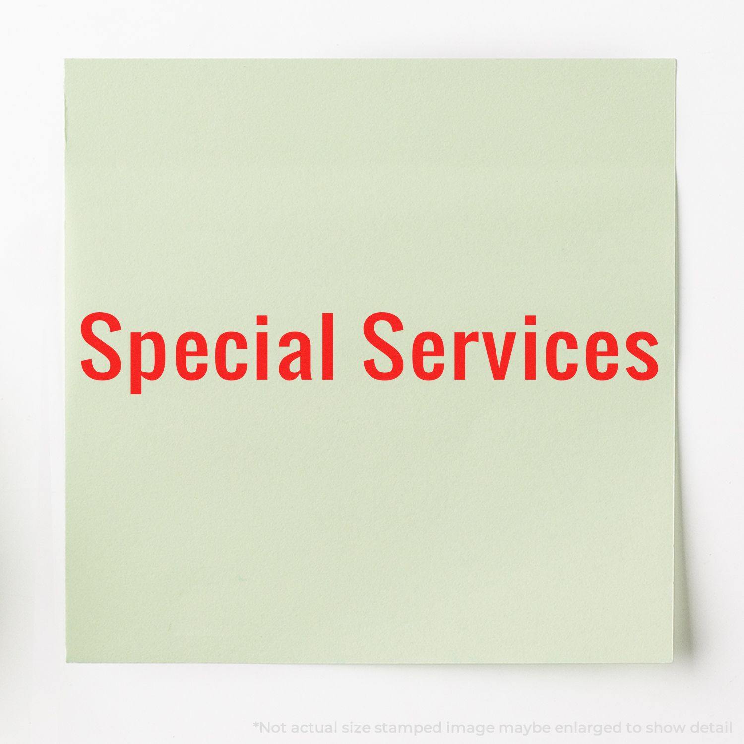 A green paper stamped with Special Services in red ink using the Large Pre-Inked Special Services Stamp.