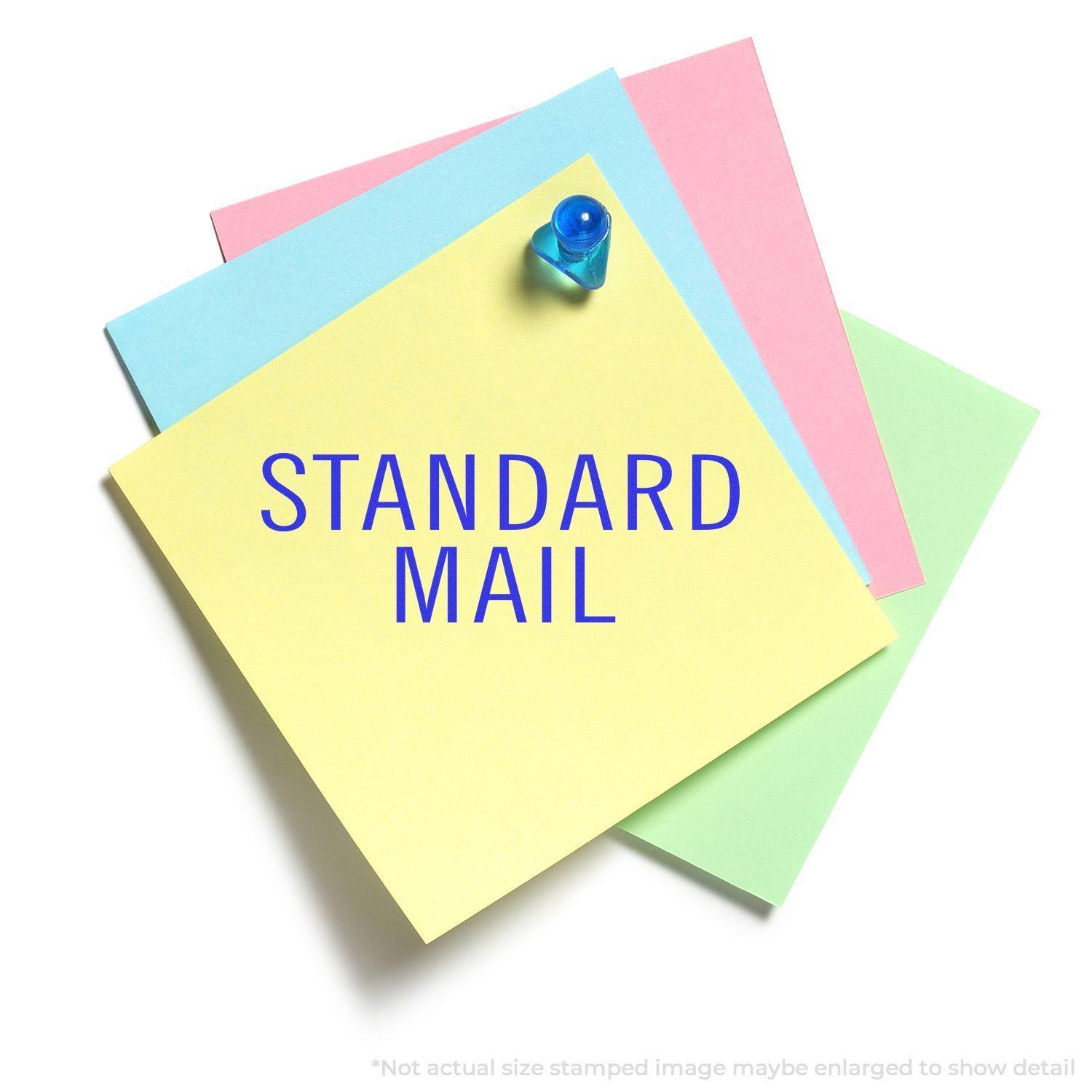 Large Pre-Inked Standard Mail Stacked Stamp used on colorful sticky notes with a push pin.