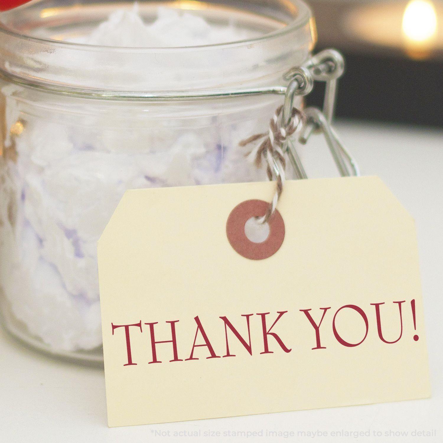 A Large Pre-Inked Thank You Stamp is used on a tag attached to a glass jar filled with crumpled paper, creating a personalized thank you gift.