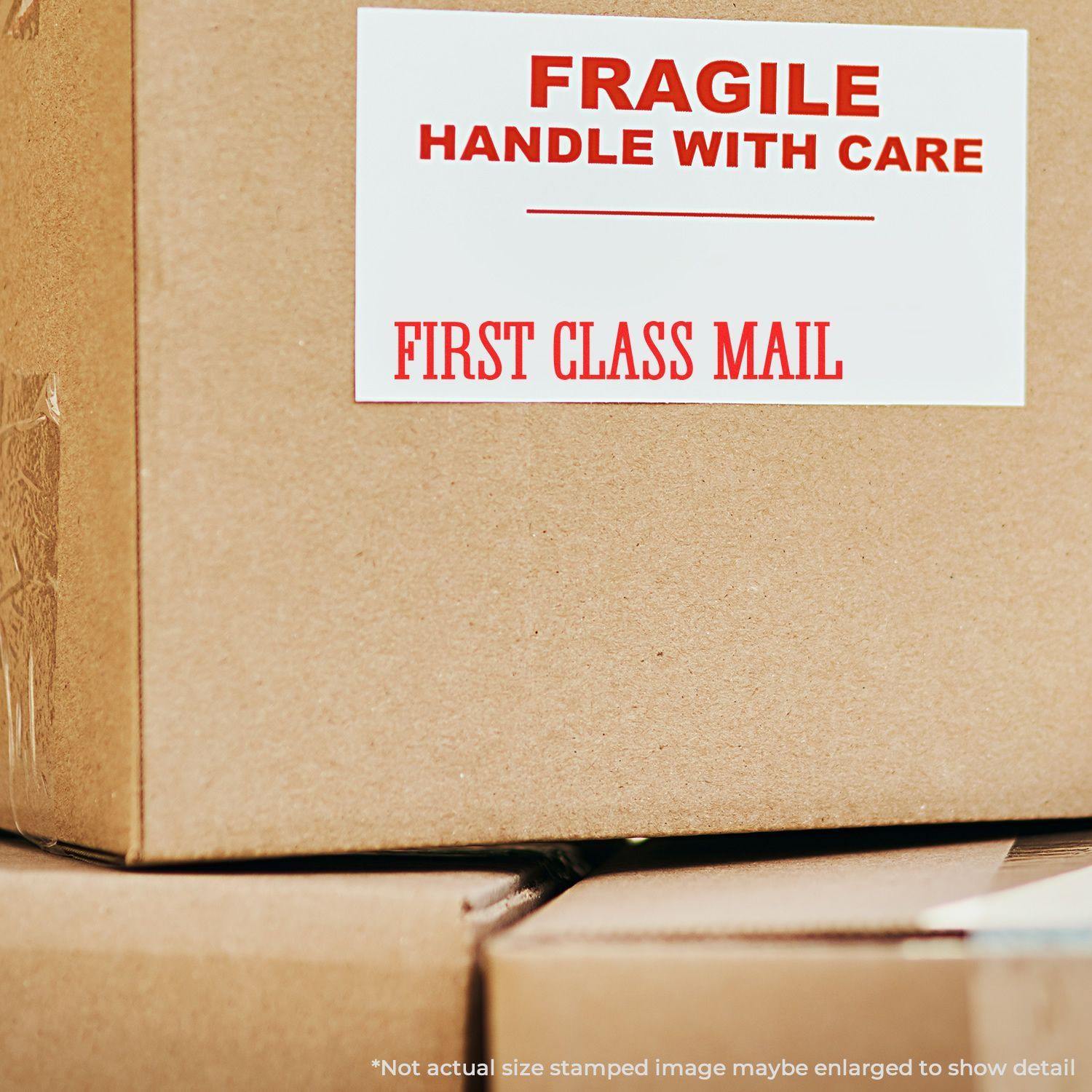 Large Pre-Inked Times First Class Mail Stamp used on a cardboard box with a label reading 'FRAGILE HANDLE WITH CARE FIRST CLASS MAIL'.