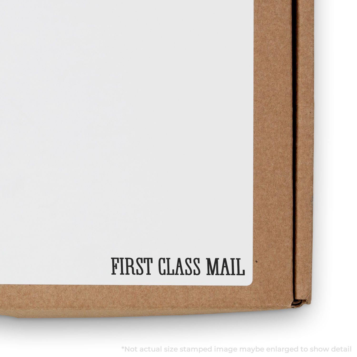 Slim Pre-Inked Times First Class Mail Stamp used on a cardboard box, showing clear and bold FIRST CLASS MAIL text.