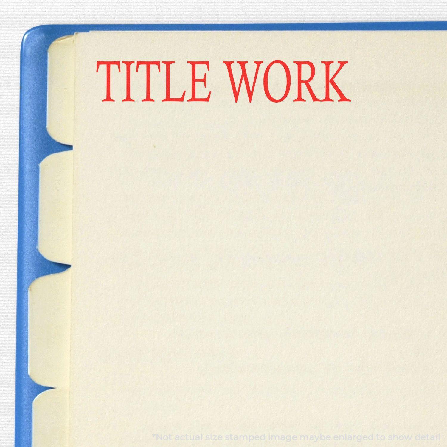 Large Self Inking Title Work Stamp in red ink used on a file folder with tabbed dividers, showing the stamped text TITLE WORK on the folder.