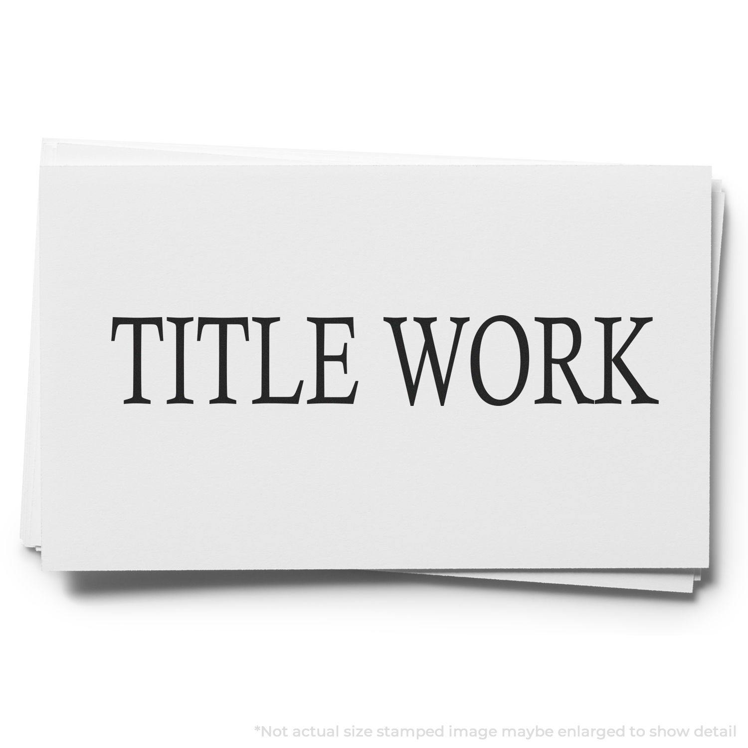 Self Inking Title Work Stamp used on a stack of white papers with the text TITLE WORK clearly visible in bold black letters.