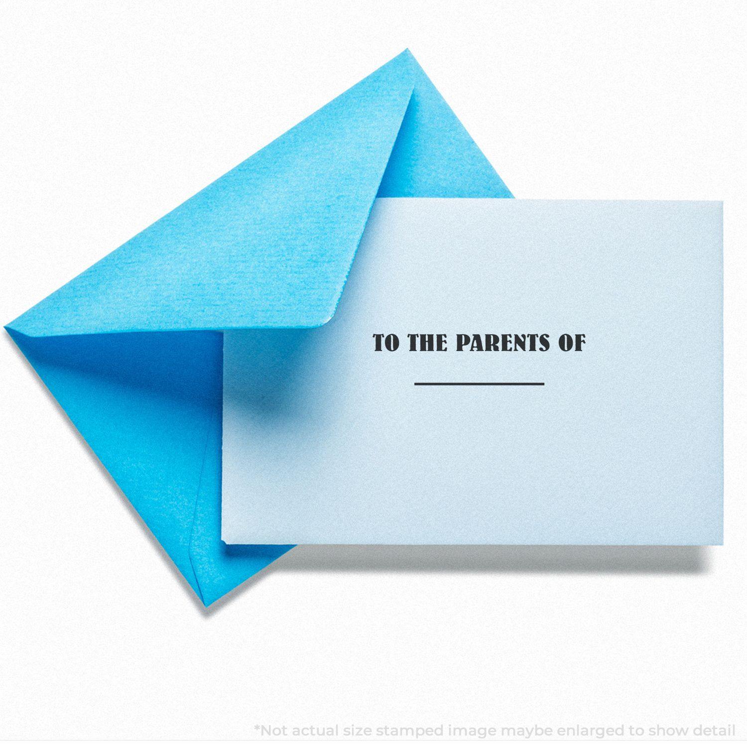 A blue envelope with a card stamped TO THE PARENTS OF using the Large Pre-Inked To The Parents Of Stamp.